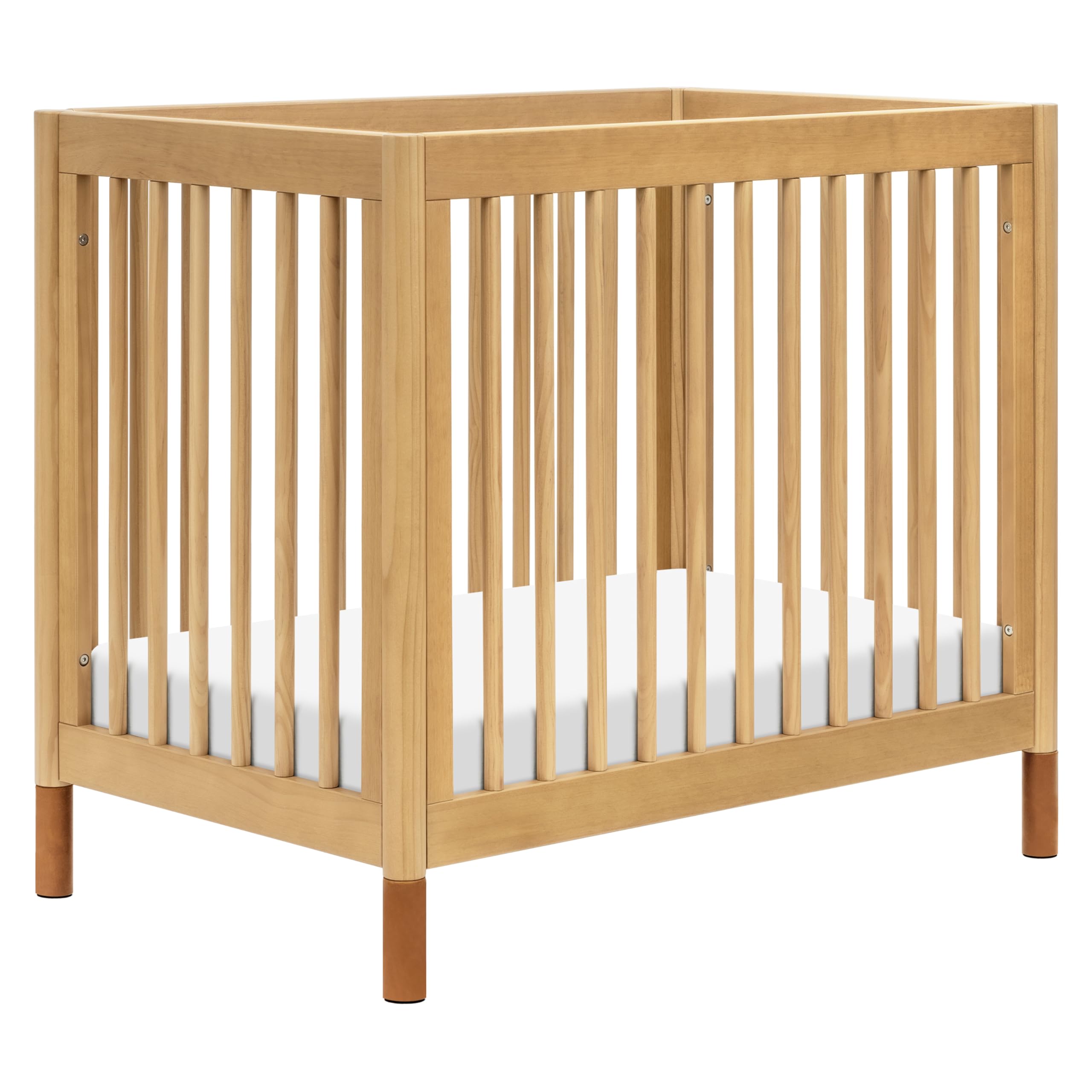 Babyletto Gelato 4-in-1 Convertible Mini Crib - GREENGUARD Gold Certified Wooden Toddler Bed, Daybed & Twin Bed with 4 Adjustable Heights - Space-Saving Nursery Furniture for Small Rooms - Honey Finish with Vegan Tan Leather - Ideal for Newborns, Infants & Toddlers in Apartments or Shared Bedrooms