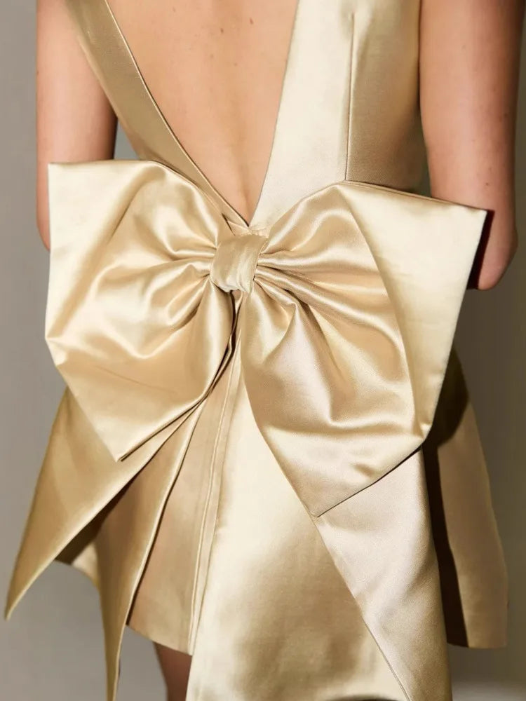Sexy Backless Mini Dress for Women - Elegant Bow Sleeveless Club Dress with High Waist & Solid O-Neck Design | Perfect for Nightclub Parties, Date Nights & Special Occasions