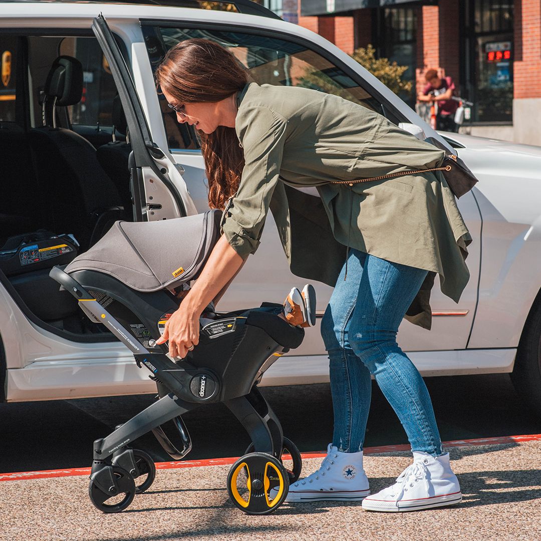Doona Infant Car Seat & Stroller with Base - 3-in-1 Travel System for Newborns to 35 lbs - Lightweight & Compact for Airplane & Car Travel - Perfect for Parents on the Go