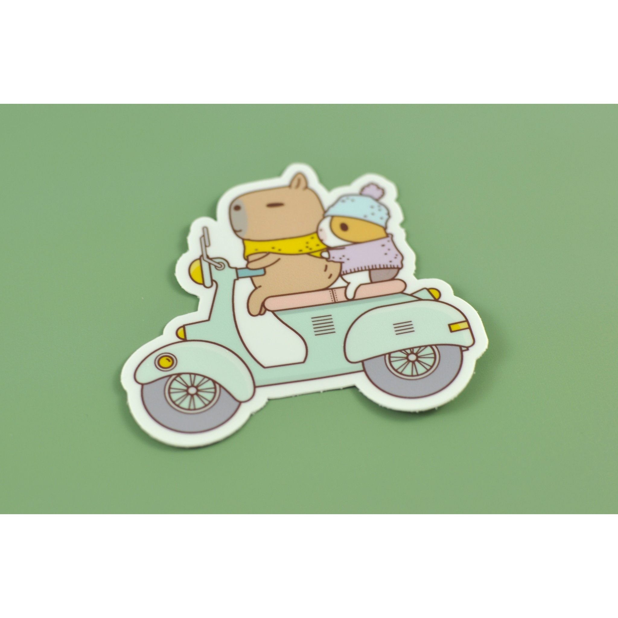 Bubu and Moonch Riding Scooter Vinyl Sticker - Waterproof Decal for Laptops, Bikes, Helmets & Skateboards - Cute Kawaii Stickers for Kids & Adults