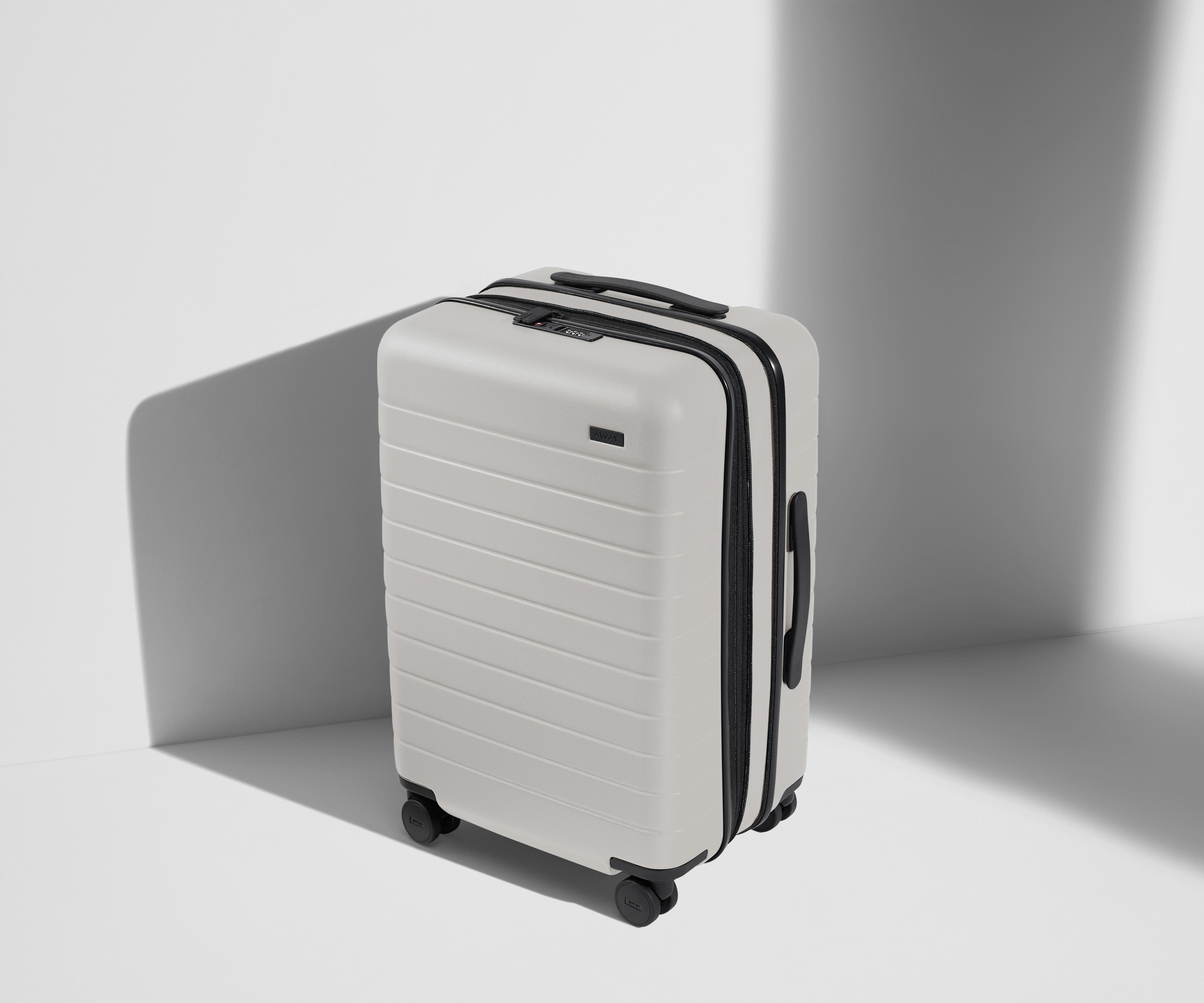 The Bigger Carry On Flex Suitcase in Cloud Gray - Lightweight Expandable Luggage for Travel, Business Trips & Weekend Getaways