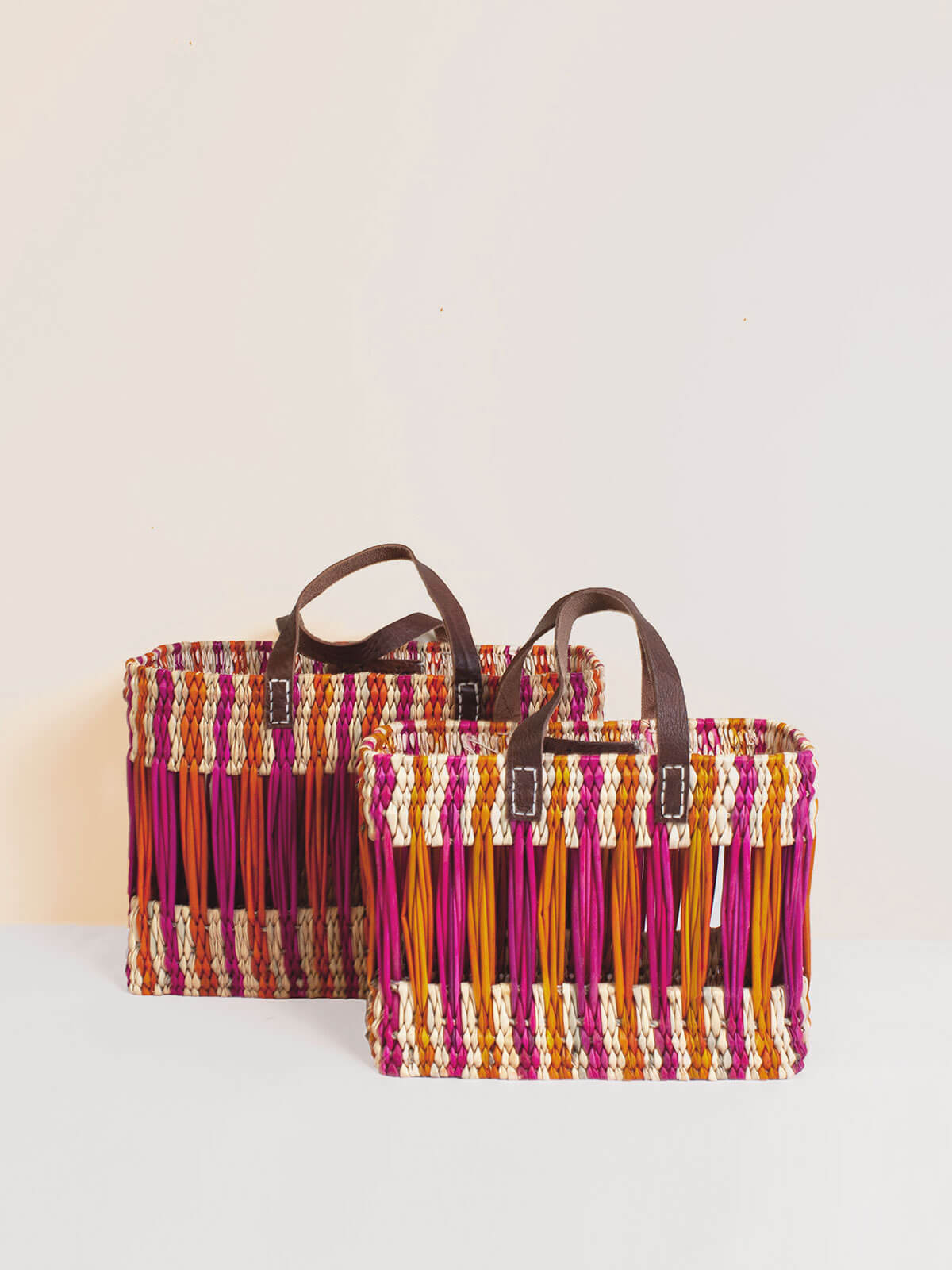 Decorative Reed Basket with Pink and Orange Stripes - Handwoven Storage Bin for Home Organization, Bathroom, Laundry, or Nursery Decor