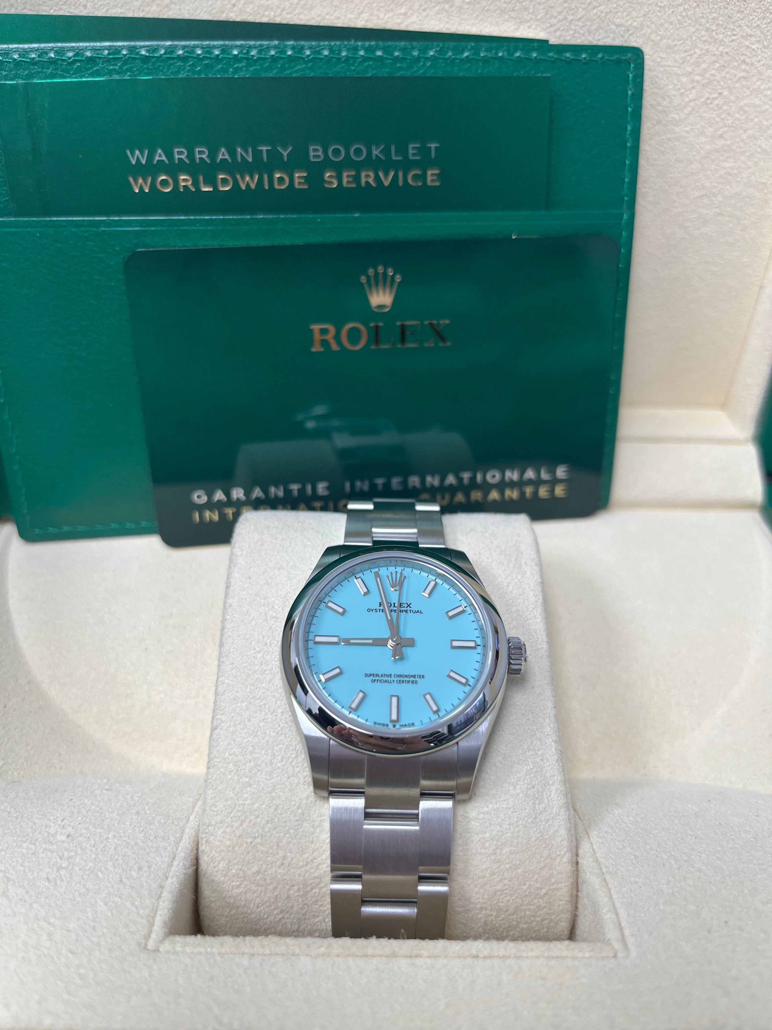 Rolex Oyster Perpetual 31mm Watch - Domed Bezel, Turquoise Blue Index Dial, Oyster Bracelet (Model 277200) | Luxury Women's Watch for Business, Parties & Special Occasions