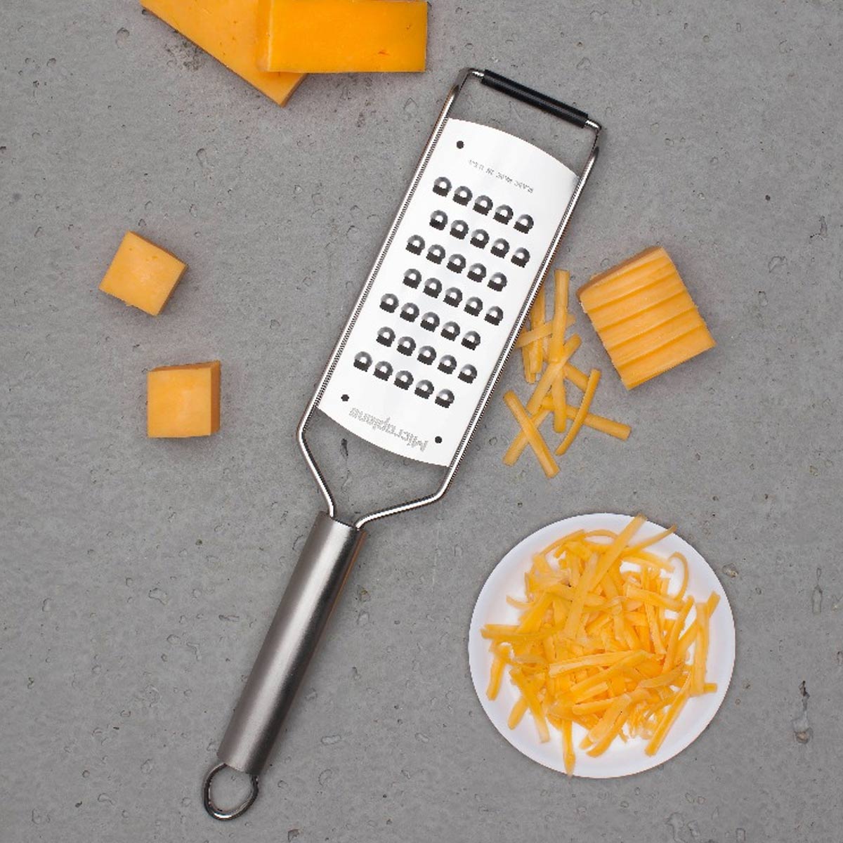 Microplane 13 Professional Series Extra Coarse Cheese Grater - Black | Premium Stainless Steel Kitchen Tool for Hard Cheeses, Zesting & Nutmeg | Perfect for Cooking, Baking & Garnishing Dishes