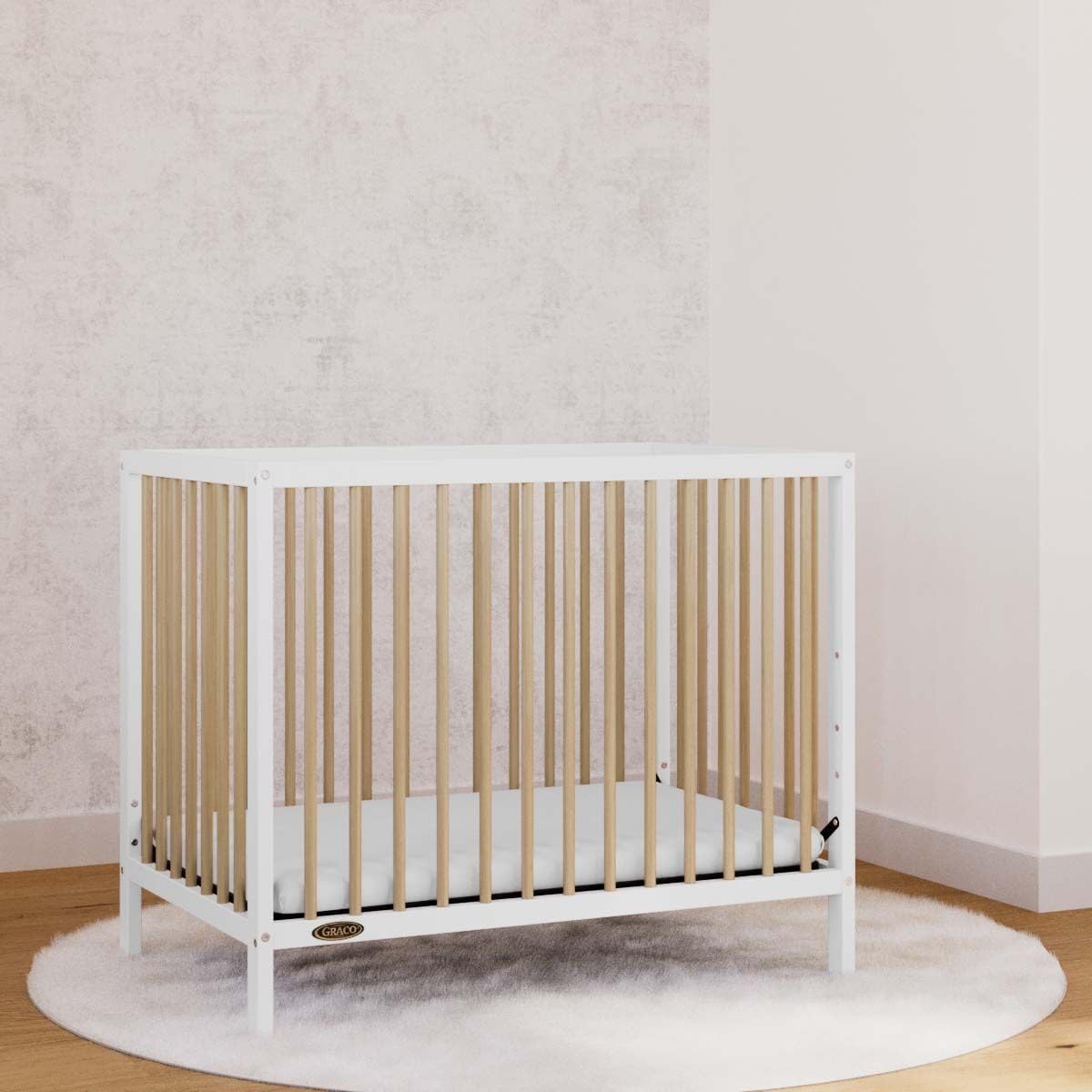 Graco Teddi 4-in-1 Convertible Mini Crib with Waterproof Mattress - GREENGUARD Gold Certified, 2.75-Inch Mattress Included, Compact Nursery Furniture for Small Spaces, Easy 30-Minute Assembly - Perfect for Apartments, Daycares & Guest Rooms