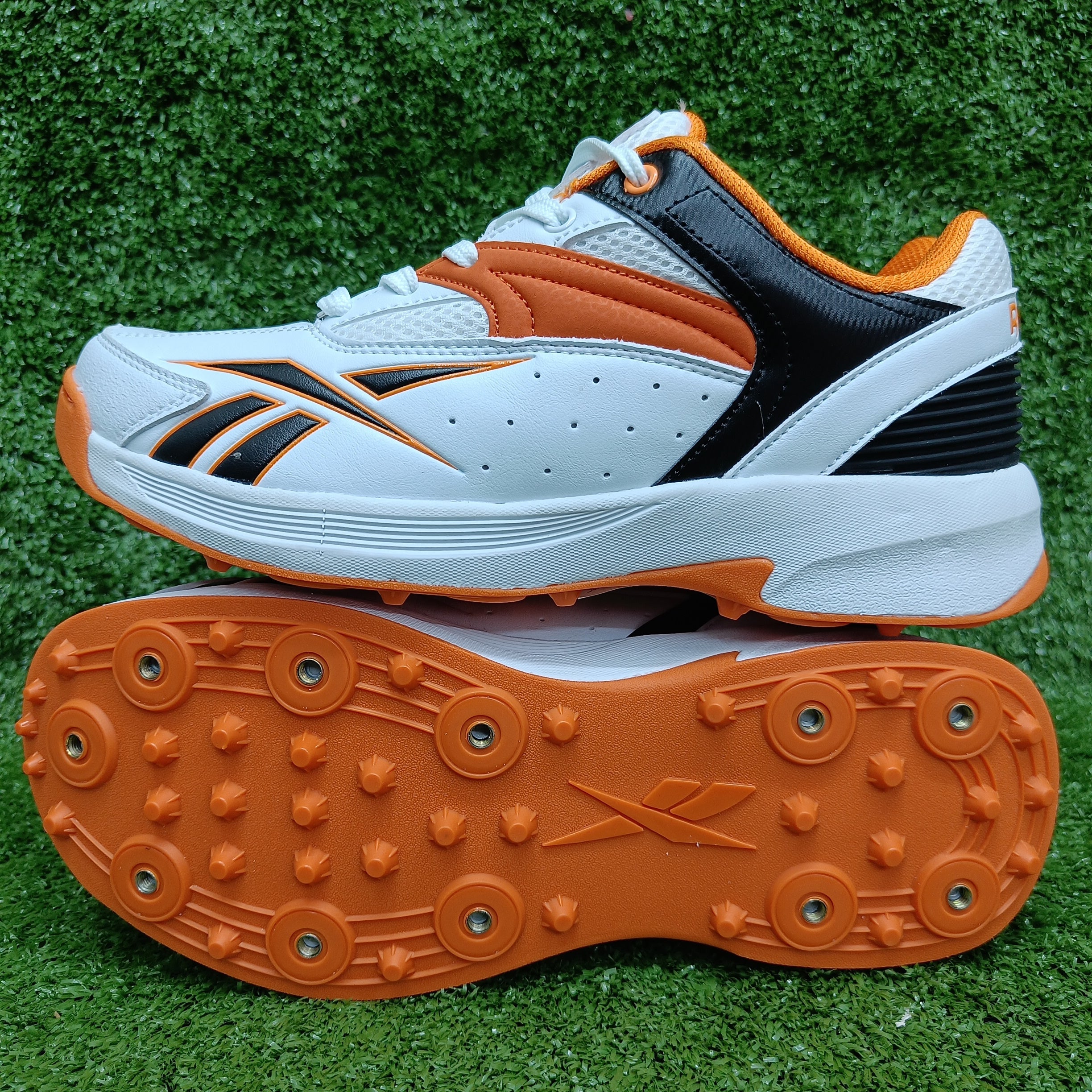 Reebok Not Out Syndicate Cricket Shoes - White, Black & Shocking Orange - Metal Spike Cleats for Enhanced Grip & Performance on the Pitch | Perfect for Professional & Amateur Cricket Matches
