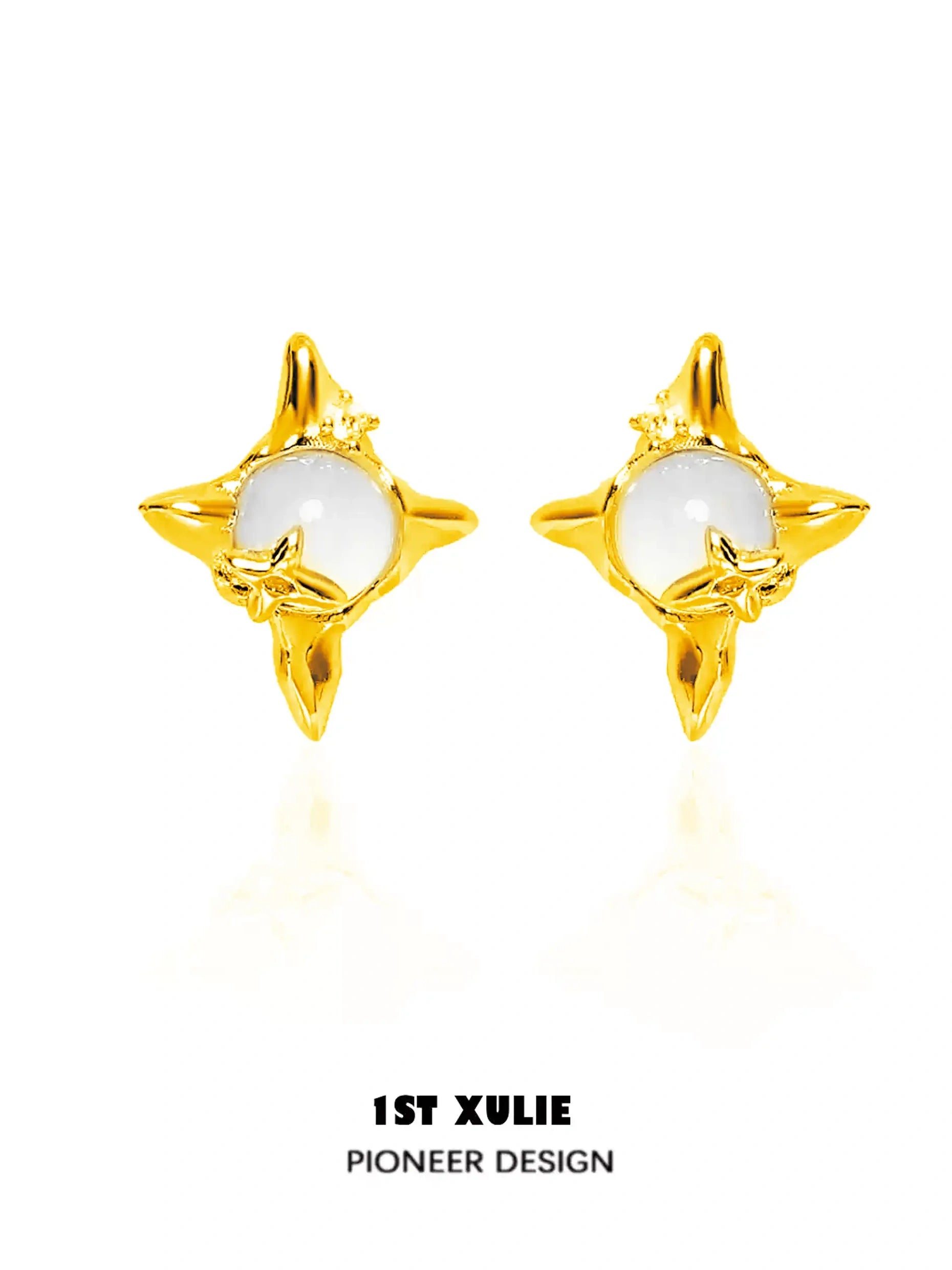 A pair of gold earrings