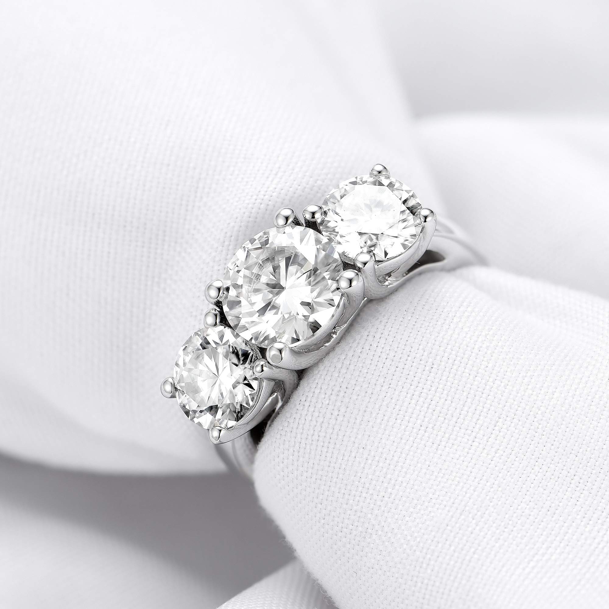 DovEggs 3 Stone Moissanite Engagement Ring for Women - 4ct Center (6.5mm-8mm-6.5mm) GHI Color H&A Cut Wedding Band, 14K Gold or Sterling Silver - Perfect for Proposals, Anniversaries & Special Occasions