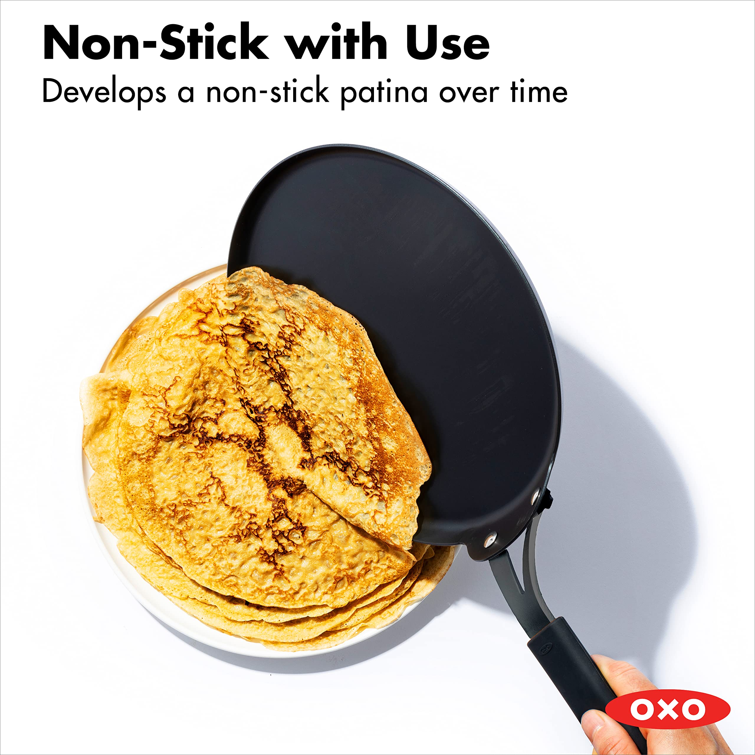 OXO Obsidian Pre-Seasoned 10-Inch Carbon Steel Crepe & Pancake Griddle Pan - Induction & Oven Safe with Removable Silicone Handle Holder - Perfect for Breakfast, Brunch & Camping Cooking - Black
