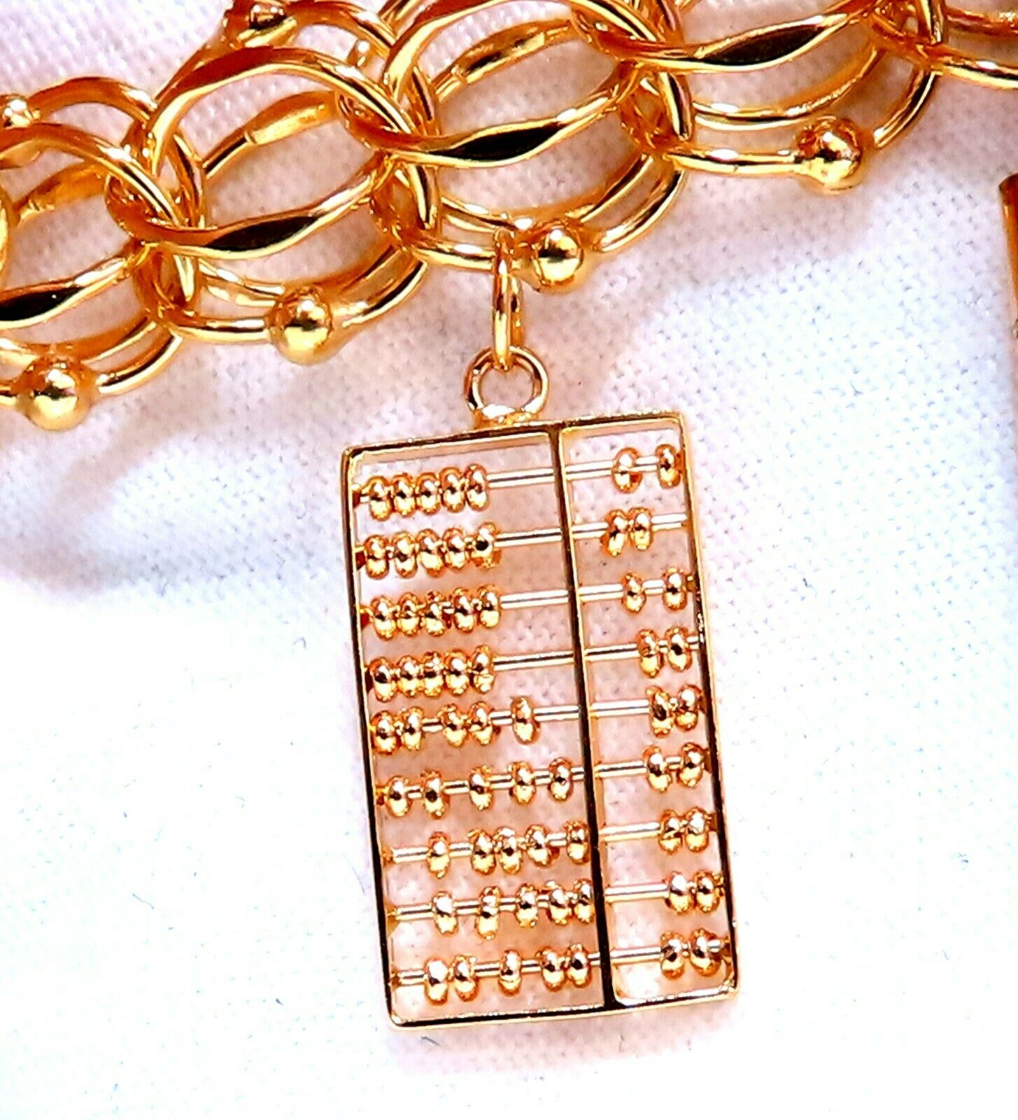 14kt Gold Nine Charms Link Bracelet - 7 Inch, 54 Grams - Perfect for Gifts, Anniversaries & Everyday Elegance