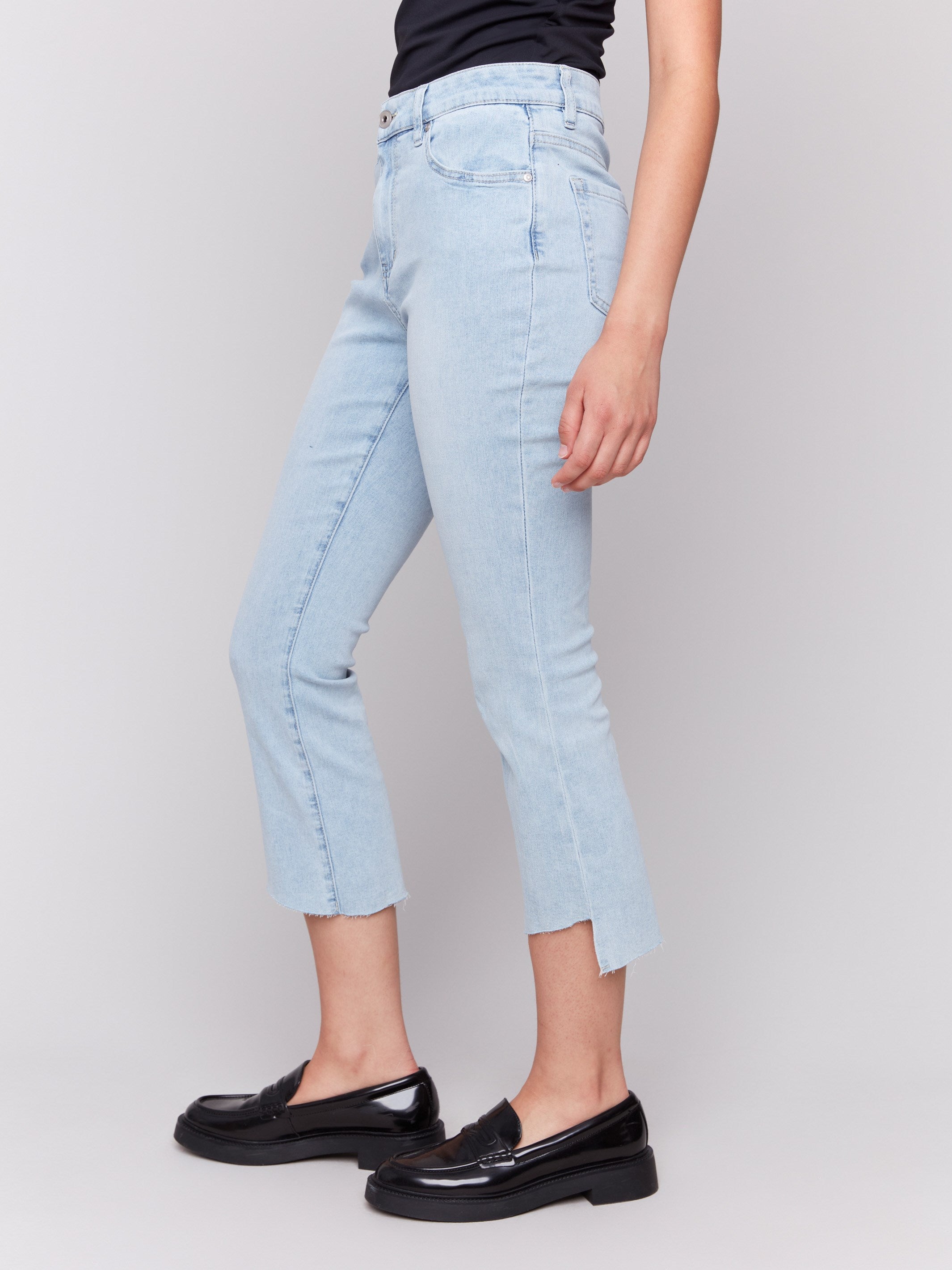 Stylish Cropped Jeans with Asymmetrical Hem in Bleach Blue Wash | Trendy High-Waisted Denim for Women | Perfect for Casual Outings & Streetwear Fashion