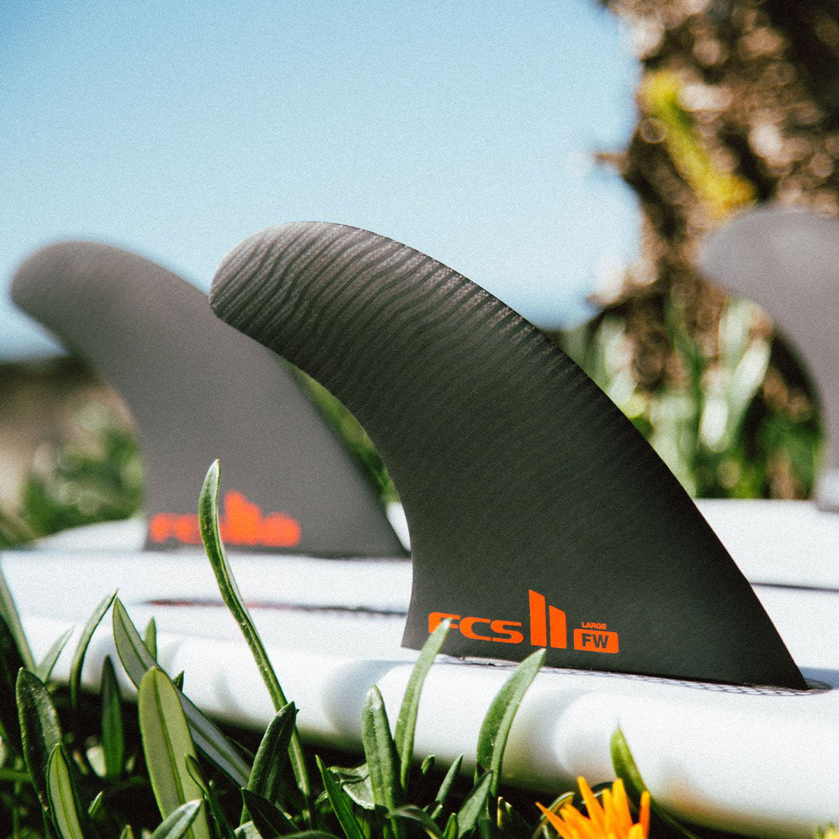 FCS II THRUSTER Firewire Surfboard Fins - PC Black Tri Fin Set (Medium Size) | Perfect for Shortboard Surfing & Performance Waves