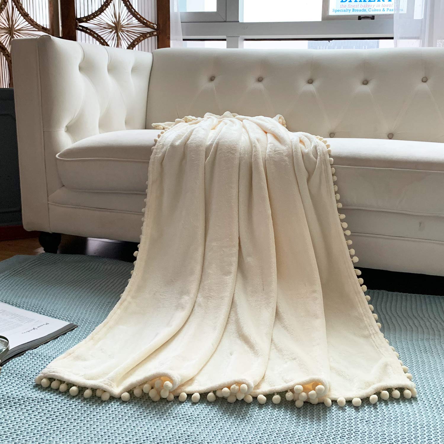 LOMAO Soft Flannel Blanket with Pompom Fringe - Lightweight Cozy Throw Blanket for Bed, Couch & Sofa - All Season Warm Fleece Blanket (Ivory, 51x63 Inches) - Perfect for Home, Office, Travel & Gift Giving