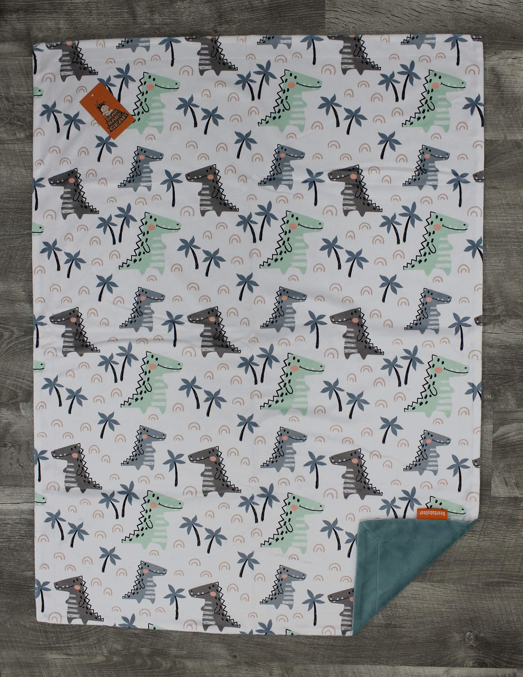 Dear Baby Gear Deluxe Baby Blanket - Soft Reversible Unisex Blanket for Newborns & Infants - Double Layer Crib Bedding Decor (Dinosaur & Palm Tree Print, Blue/Green, 40x30 Inches) - Perfect for Nursery, Stroller & Swaddling