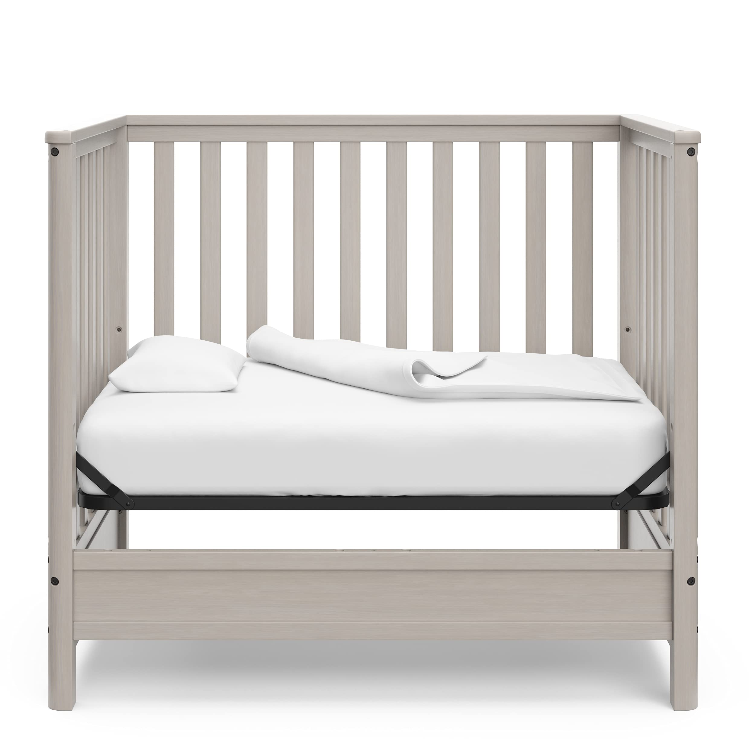 Storkcraft 5-in-1 Convertible Mini Crib with Bonus 2.75