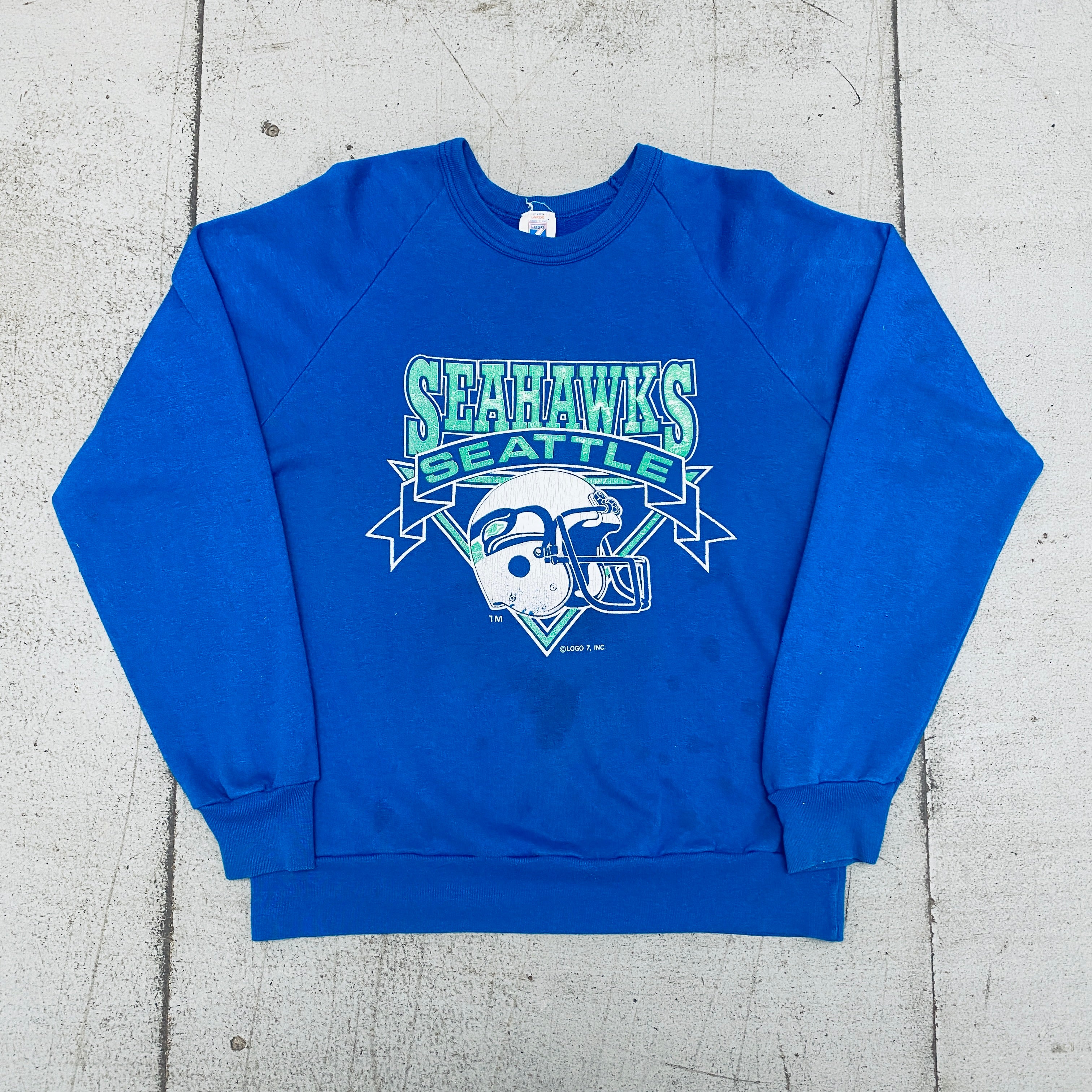 Seattle Seahawks Vintage 1990s Logo 7 Graphic Spellout Sweatshirt (Small) - Perfect for Game Day, Sports Fans & Retro Fashion Enthusiasts