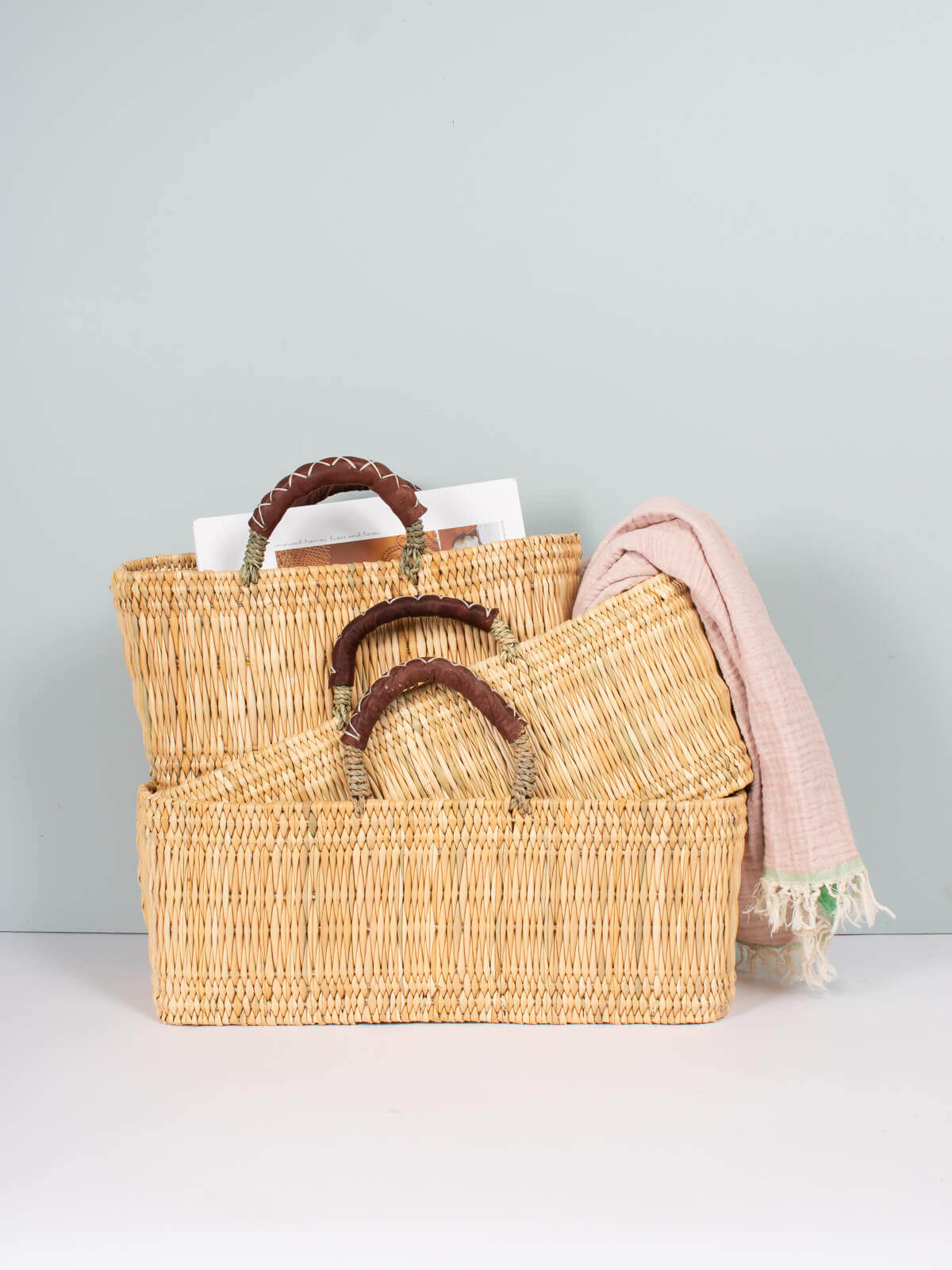 Handwoven Reed Basket with Genuine Leather Handles - Natural Woven Storage Bin for Home Decor, Laundry, or Picnic Basket - Perfect for Organizing Blankets, Toys, and More