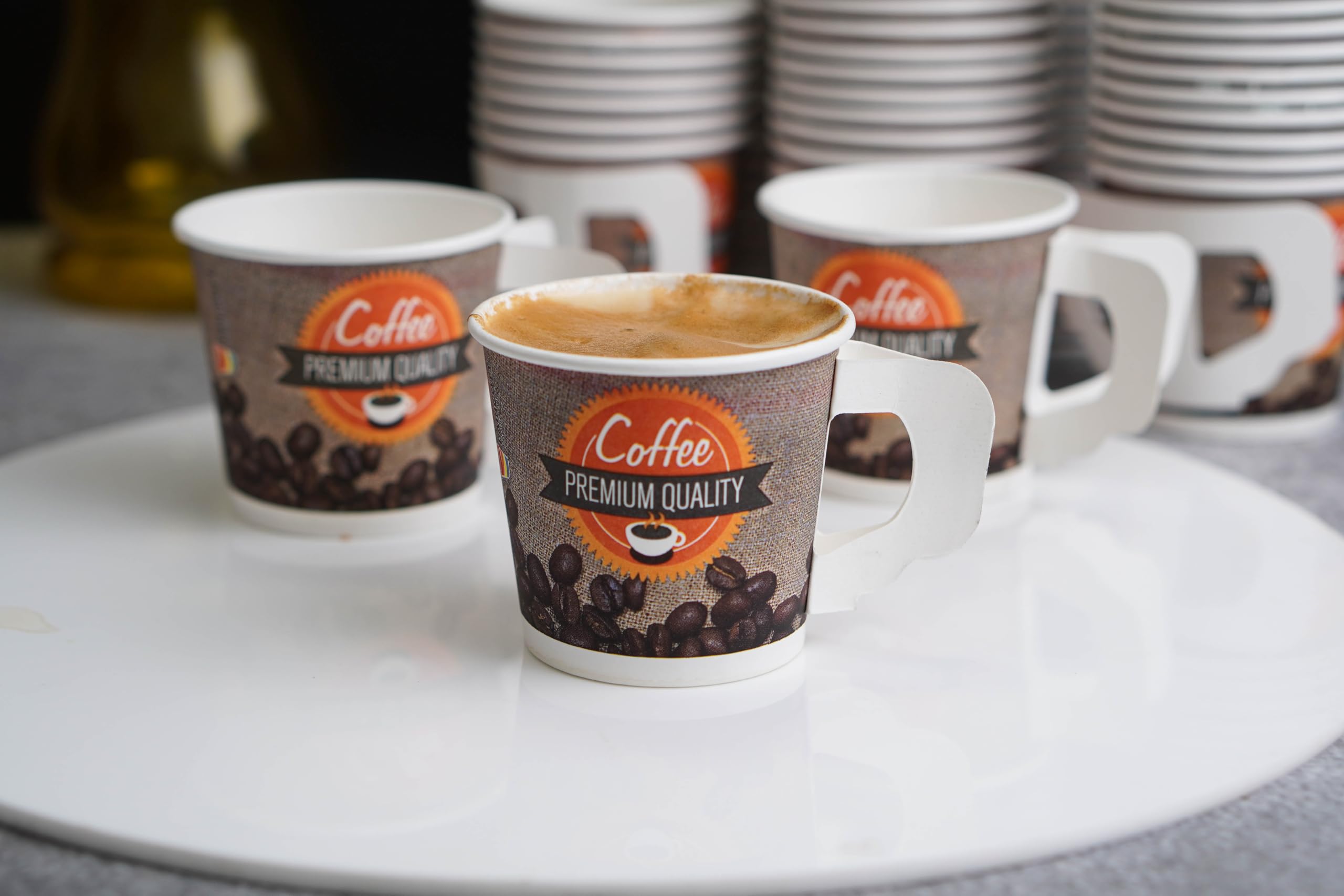 PARICOTT - 100 Pack Disposable Coffee Cups 150ml, Printed Paper Tea/Coffee Mugs, Eco-Friendly Recyclable Single-Use Drinkware for Office, Parties, Picnics & Catering Events - Multicolor Handle Cups
