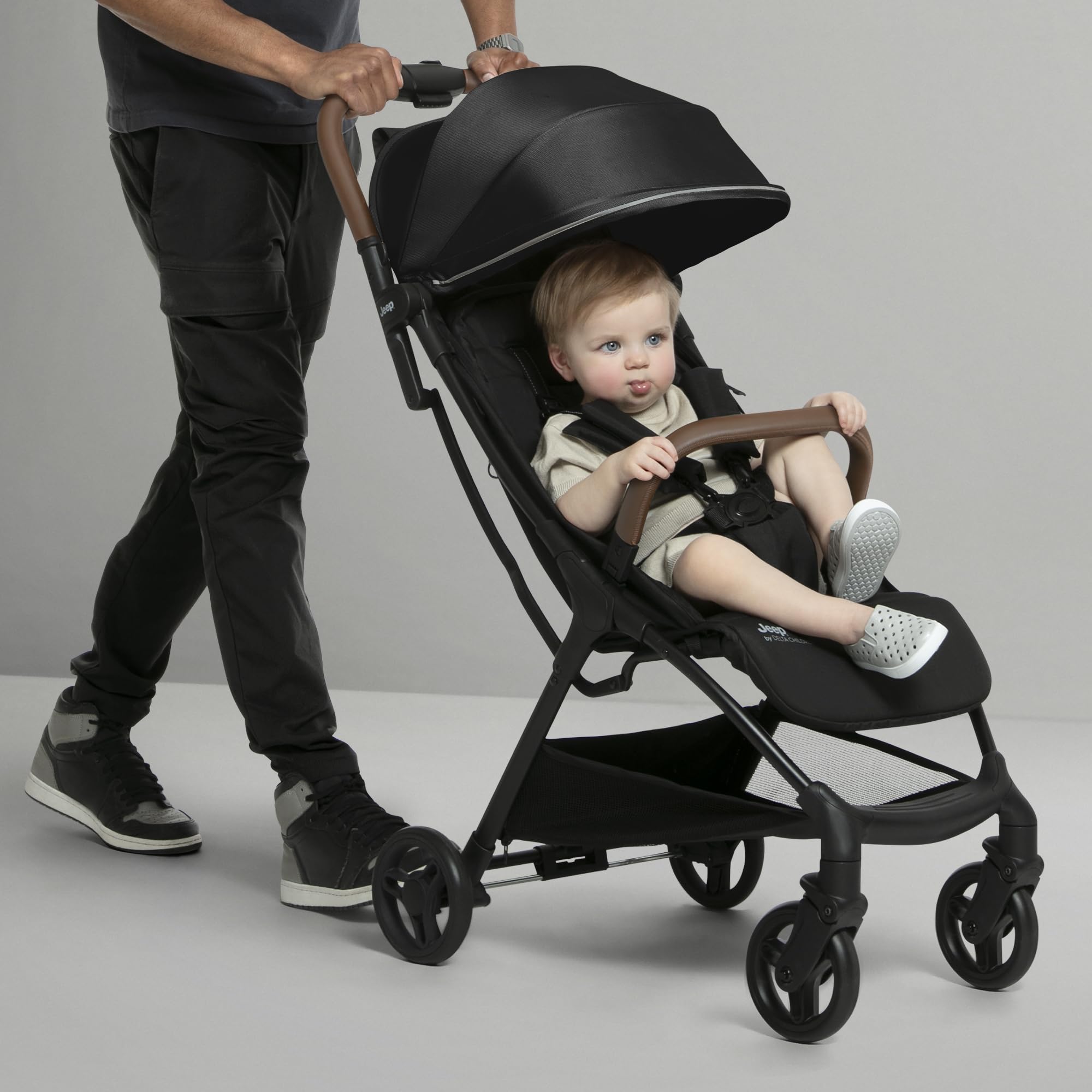 Delta Children Jeep Altitude Compact Travel Stroller - Lightweight, Easy One-Hand Fold, Extendable Canopy with Peek-a-Boo Window, Reclining Seat & 4-Wheel Suspension | Greenguard Gold Certified | Perfect for City Walks, Travel & Shopping (Black)