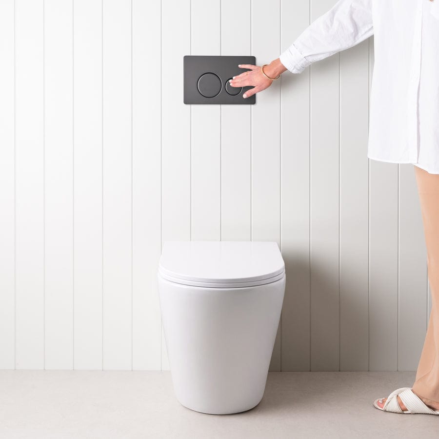 Angled In-Wall Toilet with Round Matte Black Buttons - Modern Space-Saving Bathroom Solution for Small Spaces & Contemporary Homes