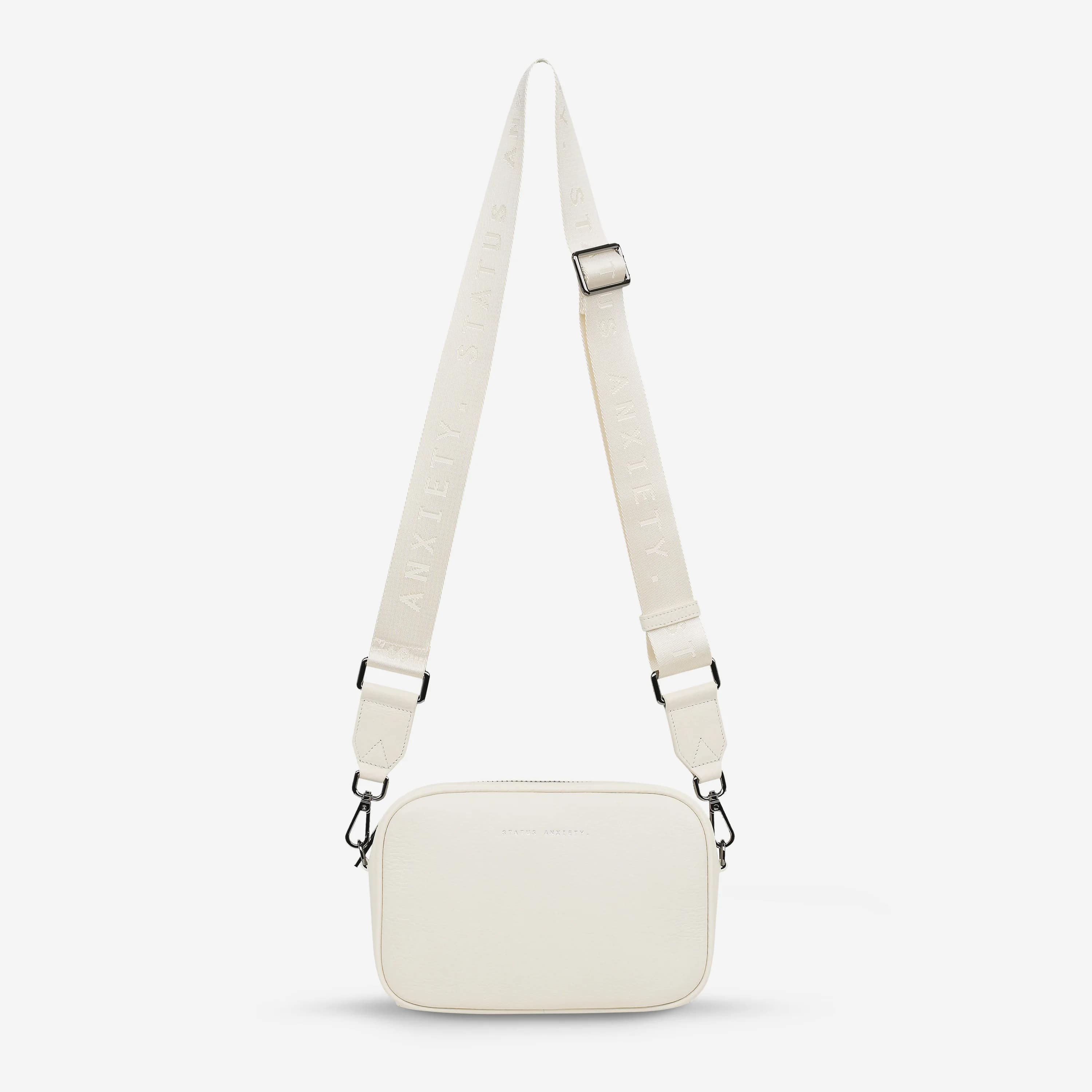 Status Anxiety Plunder Crossbody Bag with Webbed Strap in Chalk - Perfect for Everyday Use, Work, and Travel