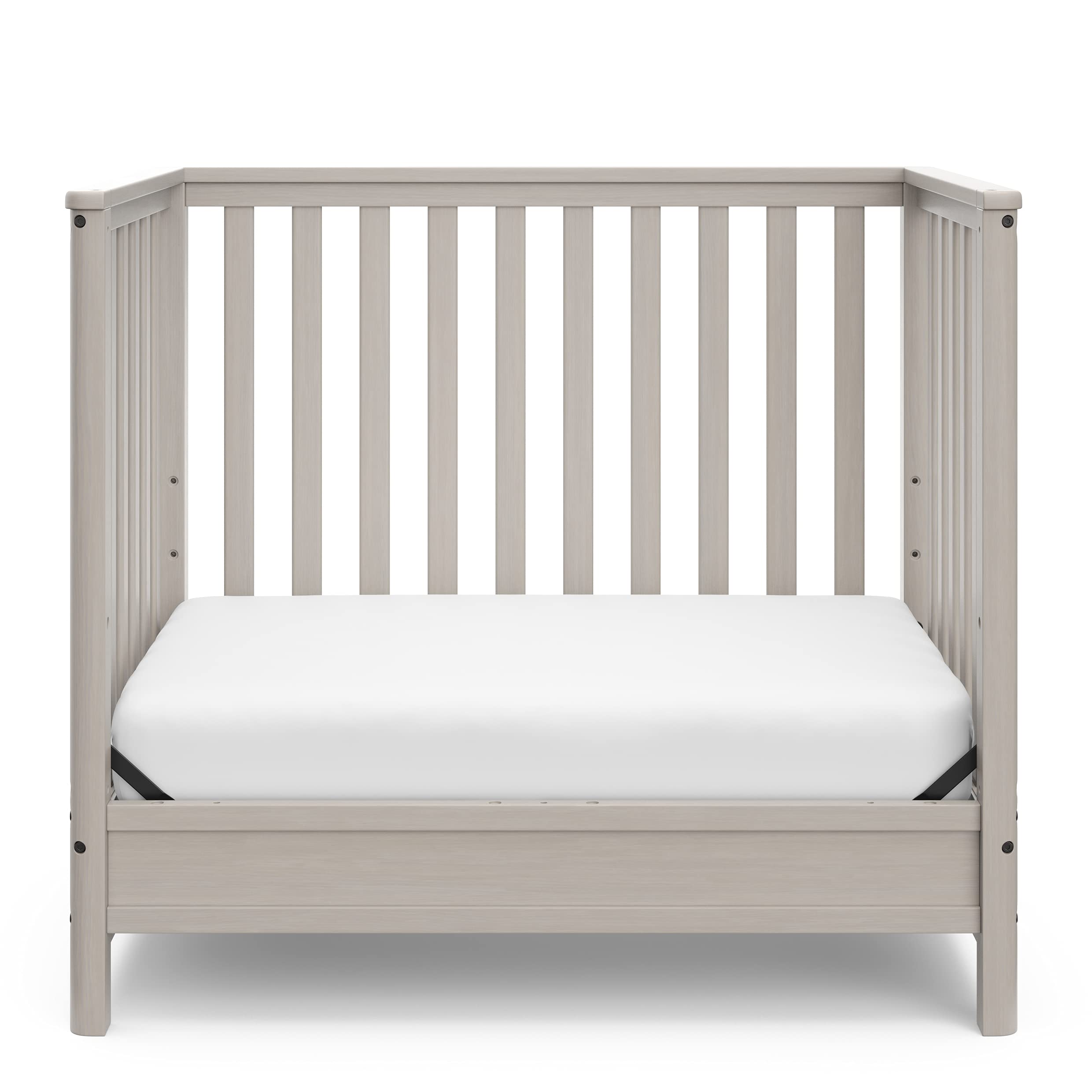 Storkcraft 5-in-1 Convertible Mini Crib with Bonus 2.75