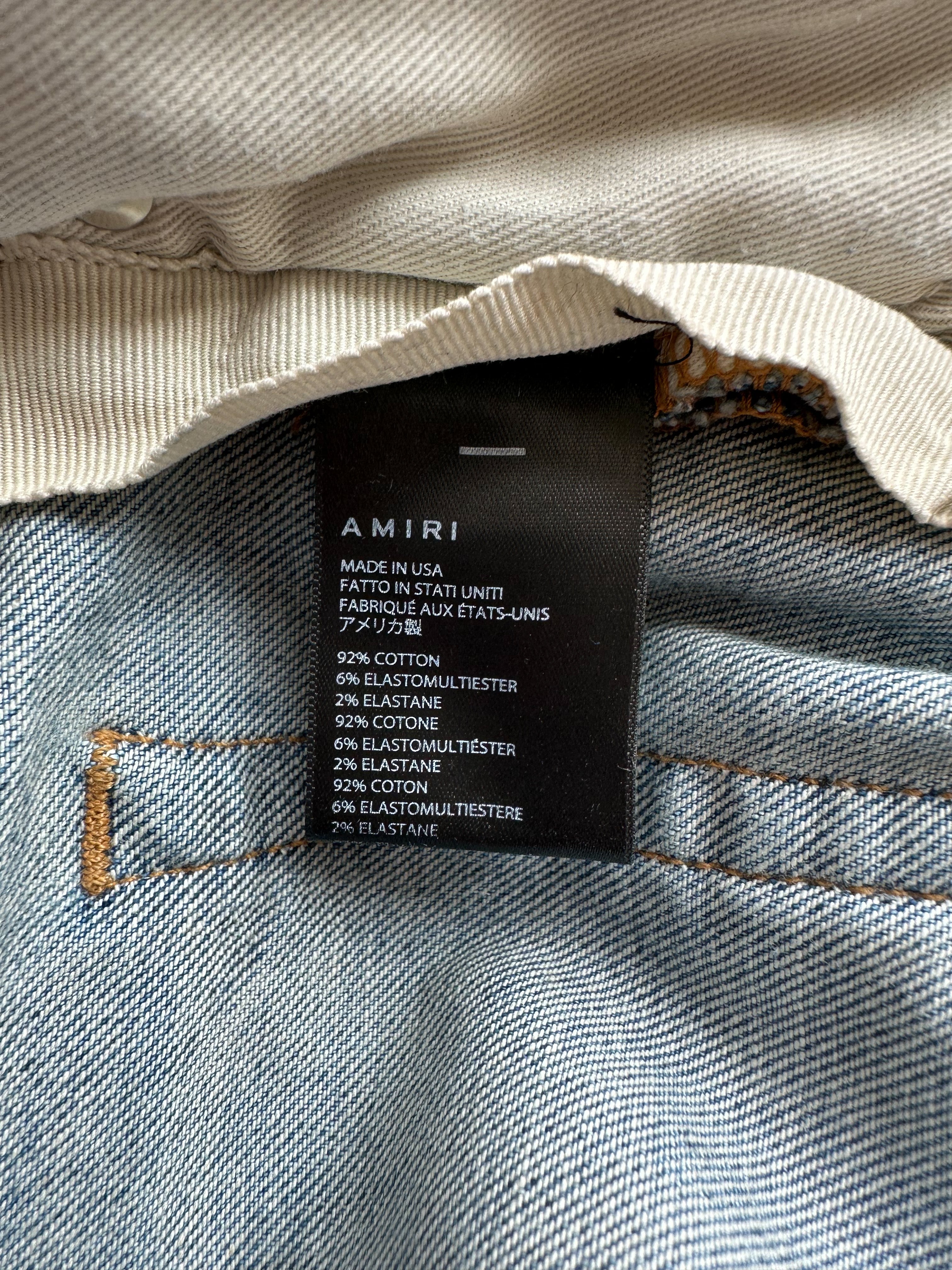 Amiri Blue Distressed Jeans with Multicolor Patches - Stylish Ripped Denim Pants for Men | Perfect for Casual Outfits, Streetwear & Night Out Looks