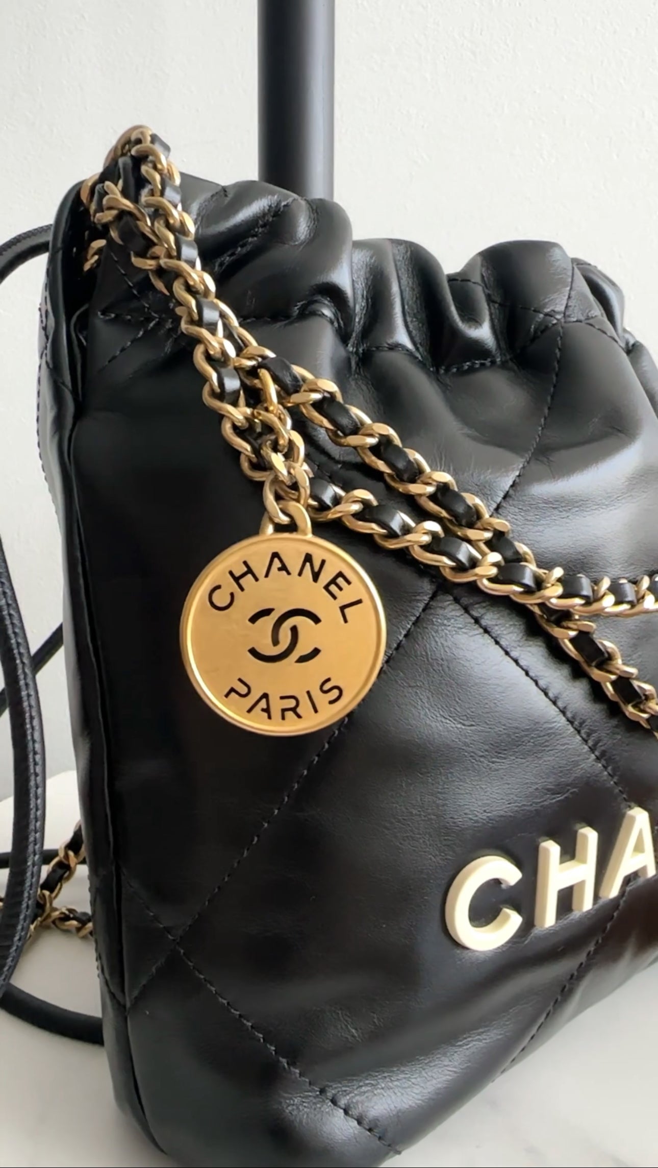 Chanel 2023 Black Leather Chain 22 Mini Bag with Ivory Enamel Logo - Luxury Designer Handbag for Women, Perfect for Evening Parties & Date Nights