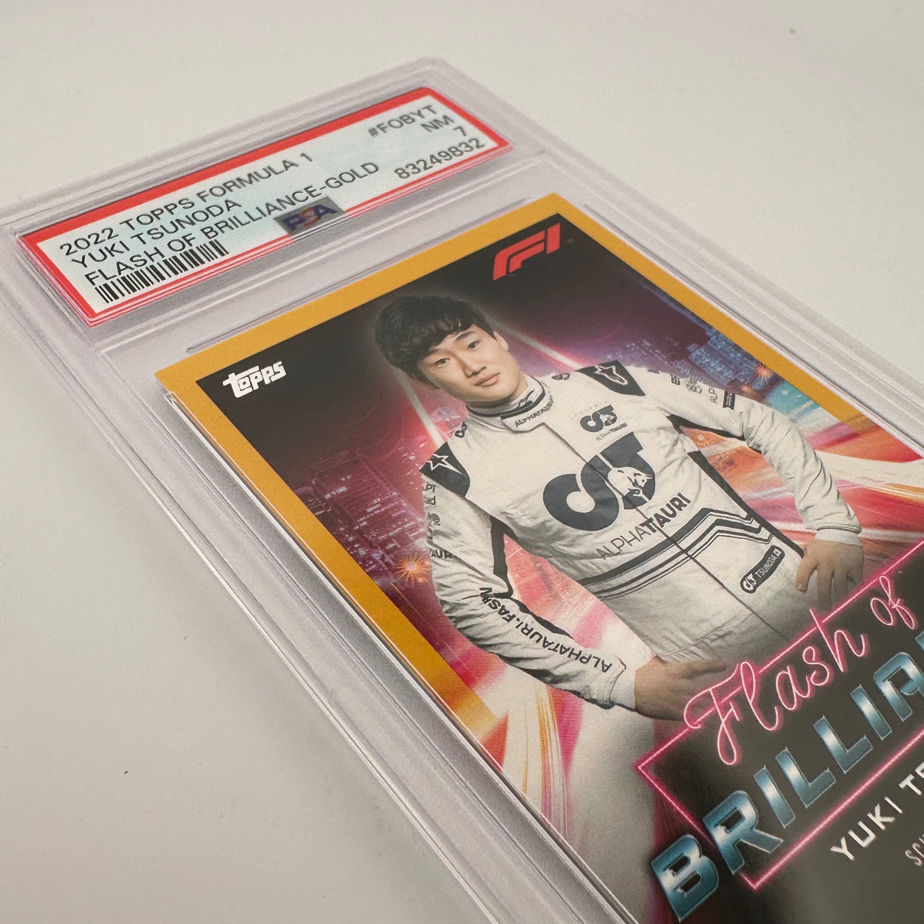 PSA 7 Graded 23/50 Yuki Tsunoda #FOBYT Flash Of Brilliance Gold Autographed Racing Card - Perfect for F1 Collectors & Motorsport Memorabilia Displays