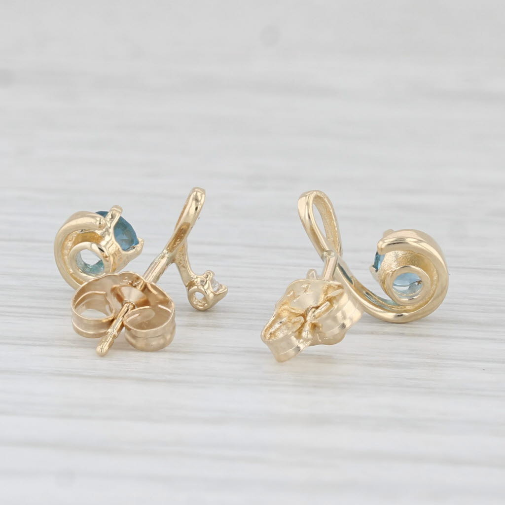 0.48ctw Blue Topaz & Diamond Swirl Stud Earrings in 14k Yellow Gold - Elegant Jewelry for Women, Perfect for Weddings, Parties & Special Occasions