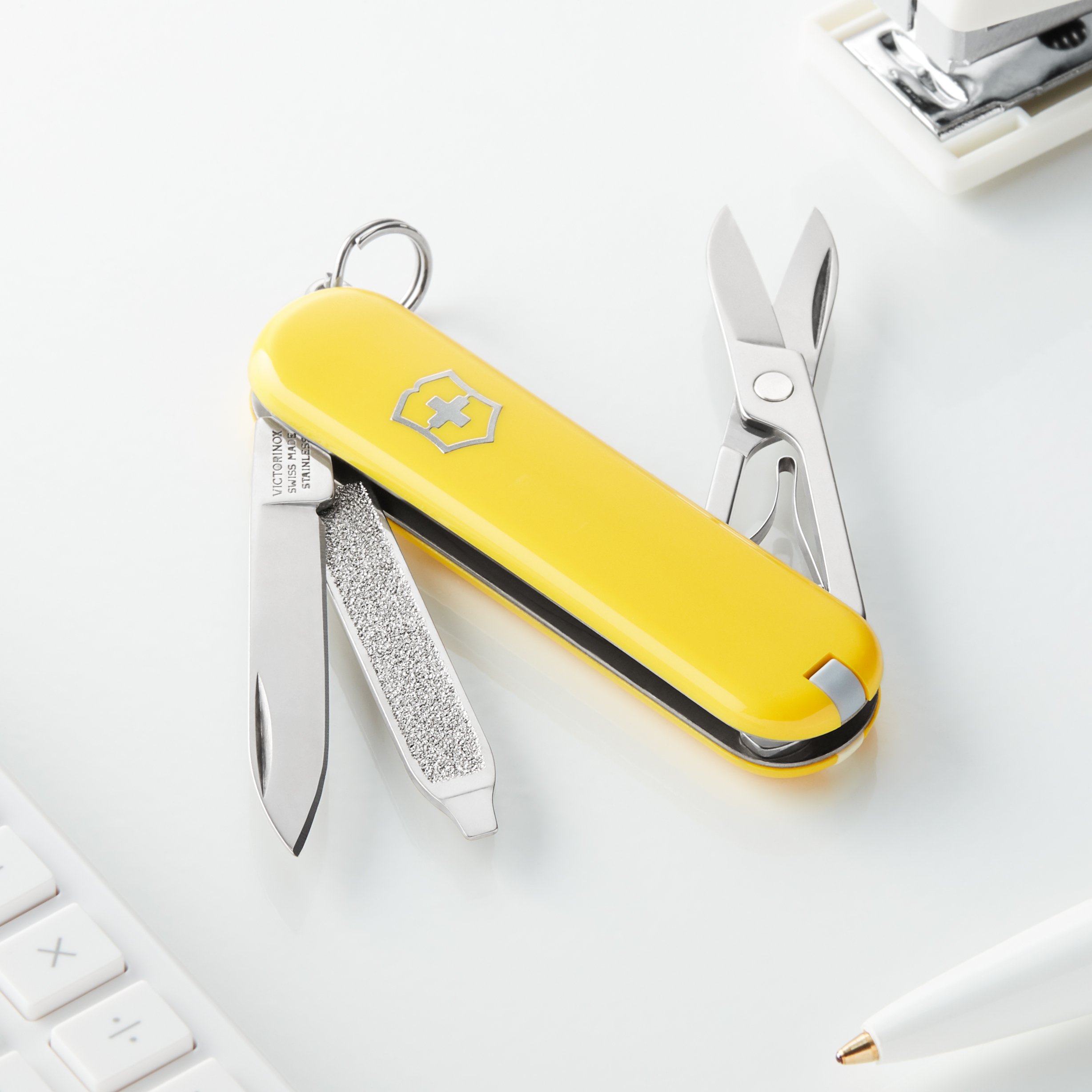 Victorinox Classic SD Swiss Army Knife - 7-in-1 Multi-Tool with Small Blade, Screwdriver & Key Ring | Compact Swiss Made Pocket Knife in Yellow | Perfect for Camping, Hiking & Everyday Carry (EDC)