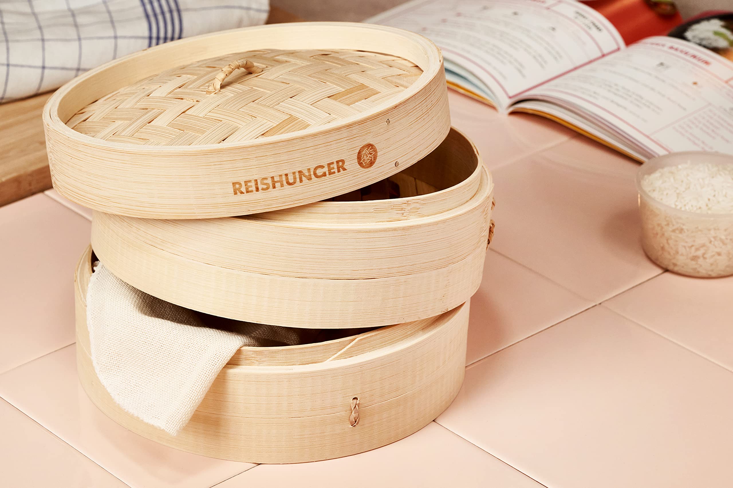 Reishunger 10 Inch Bamboo Steamer Basket - Handmade 2-Tier Traditional Design for Dumplings, Dim Sum, Vegetables, Fish & Meat - Includes 2 Cotton Liners - Perfect for Asian Cooking, Meal Prep & Healthy Steam Cooking at Home