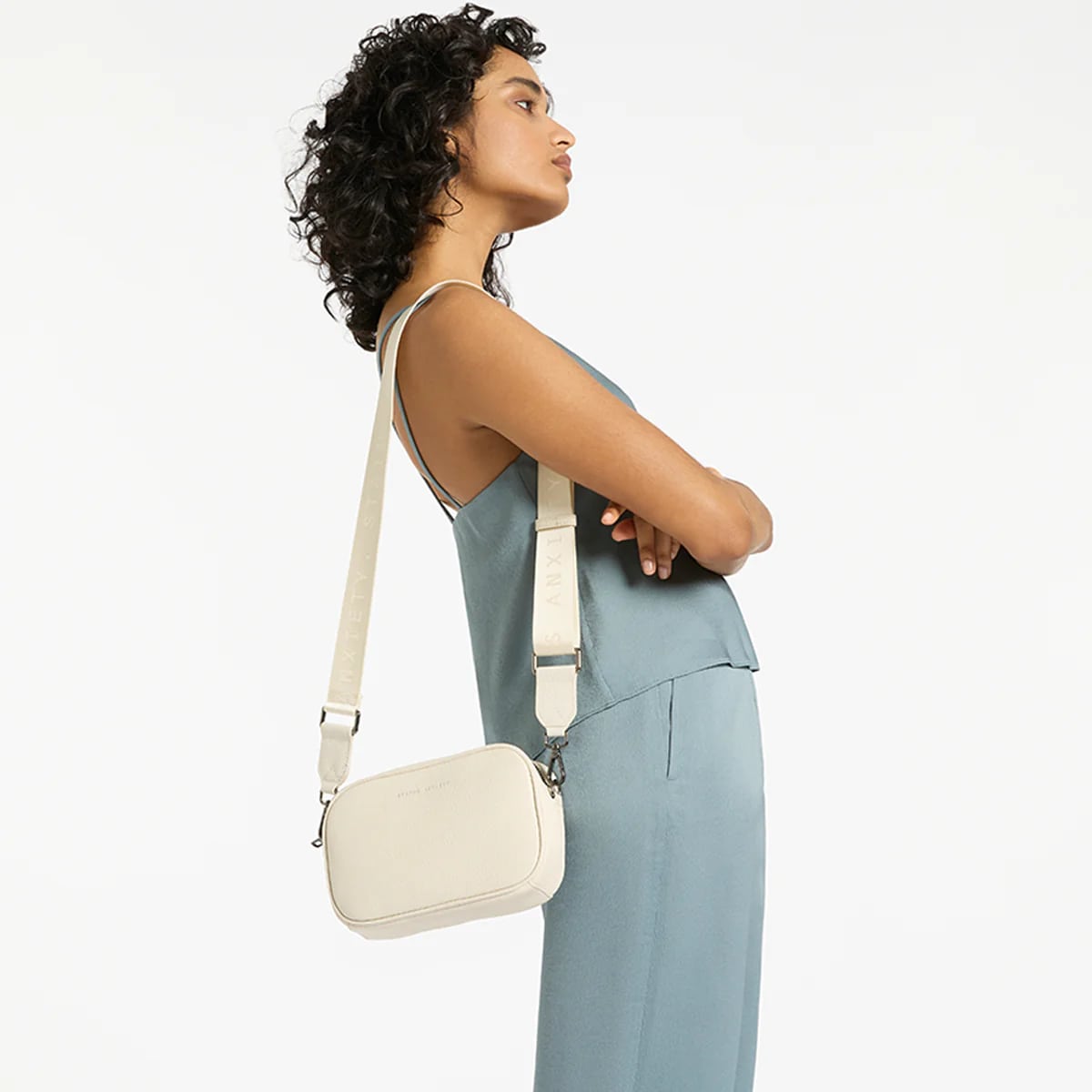 Status Anxiety Plunder Crossbody Bag with Webbed Strap in Chalk - Perfect for Everyday Use, Work, and Travel