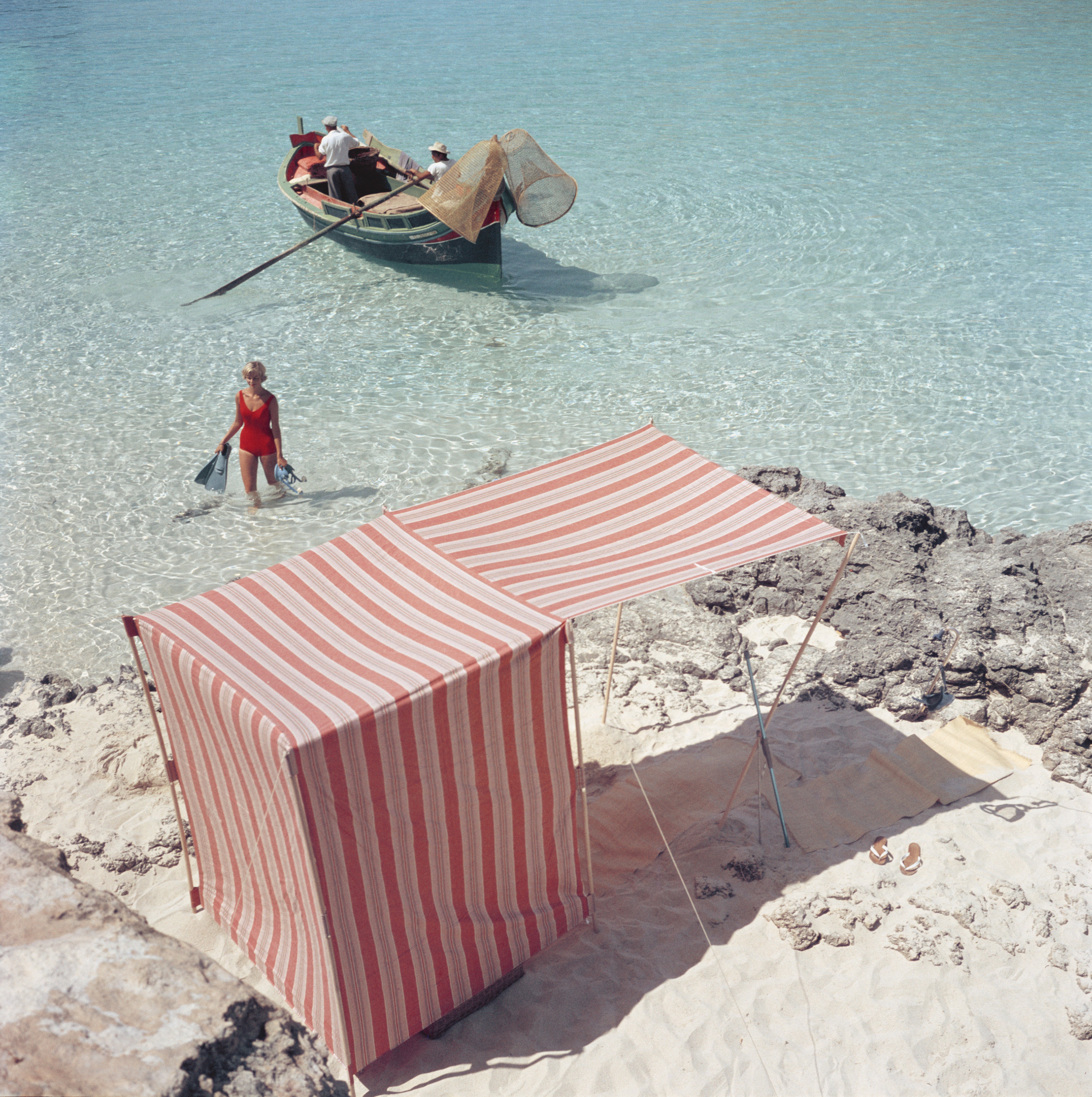Slim Aarons Martine Birnie Blue Lagoon Photograph - Vintage Wall Art for Home & Office Decor - Perfect for Living Rooms, Bedrooms & Workspaces