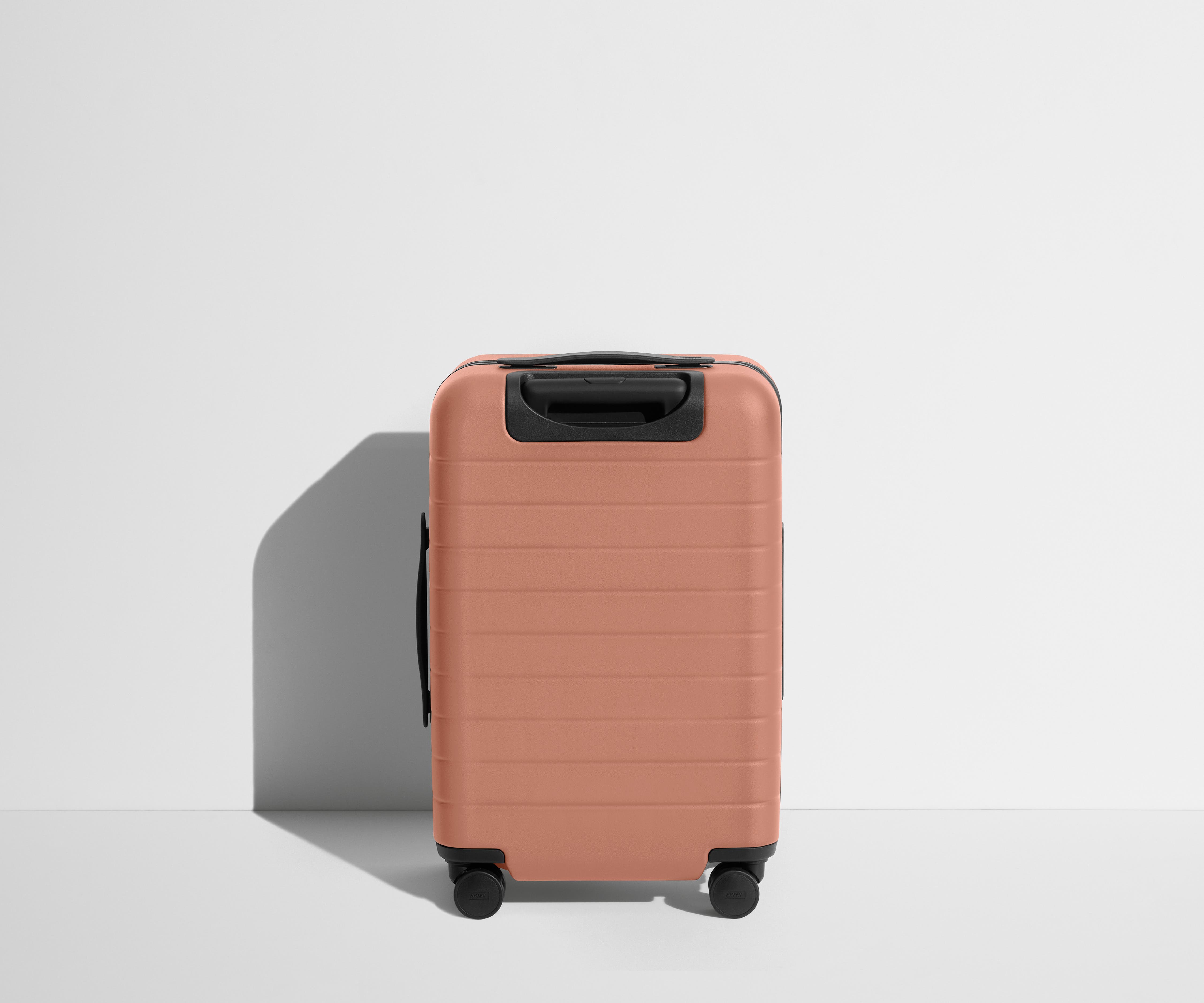 The Carry On Flex in Clay Pink - Lightweight Expandable Luggage for Travel, Business Trips & Weekend Getaways