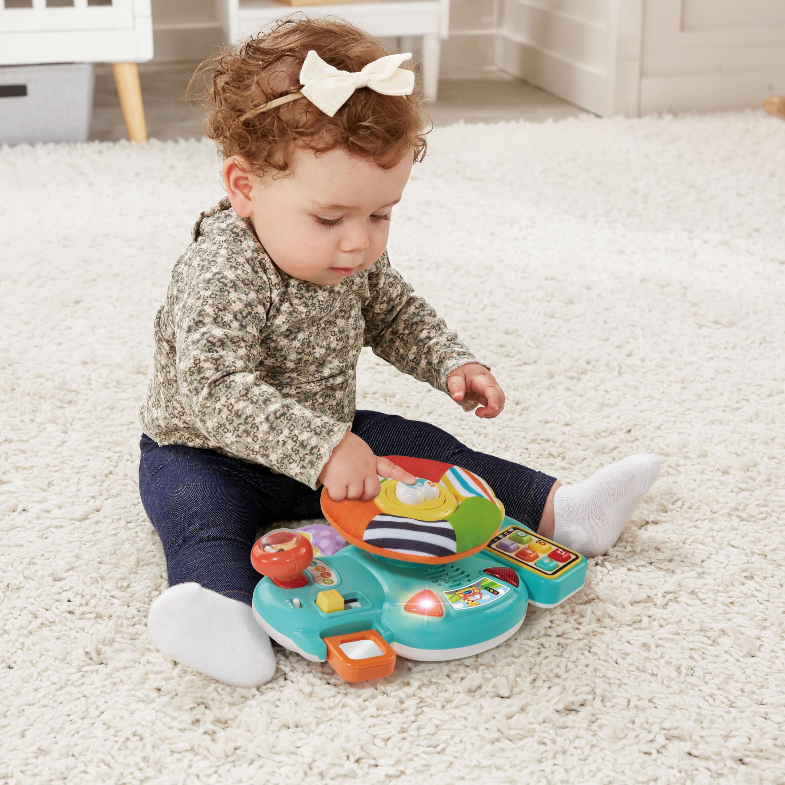 VTech Baby Steering Wheel Toy - Interactive Car Seat & Stroller Activity Toy with Lights, Sounds & Games - Best Gift for Babies 6+ Months - Spanish Language Content - Perfect for Road Trips & Stroller Rides