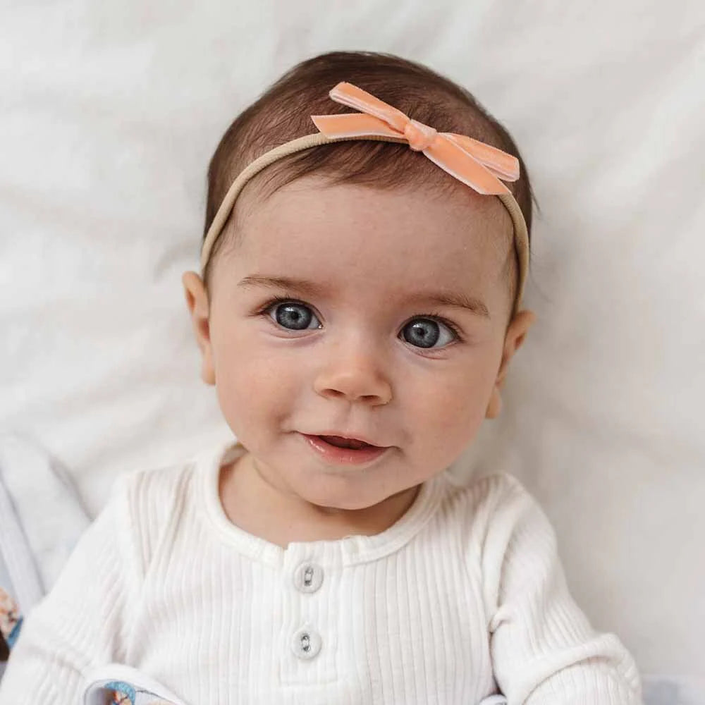 Snuggle Hunny Velvet Bow Stretchy Headband for Women - Soft Coral Hair Accessory for Workouts, Yoga, and Everyday Fashion