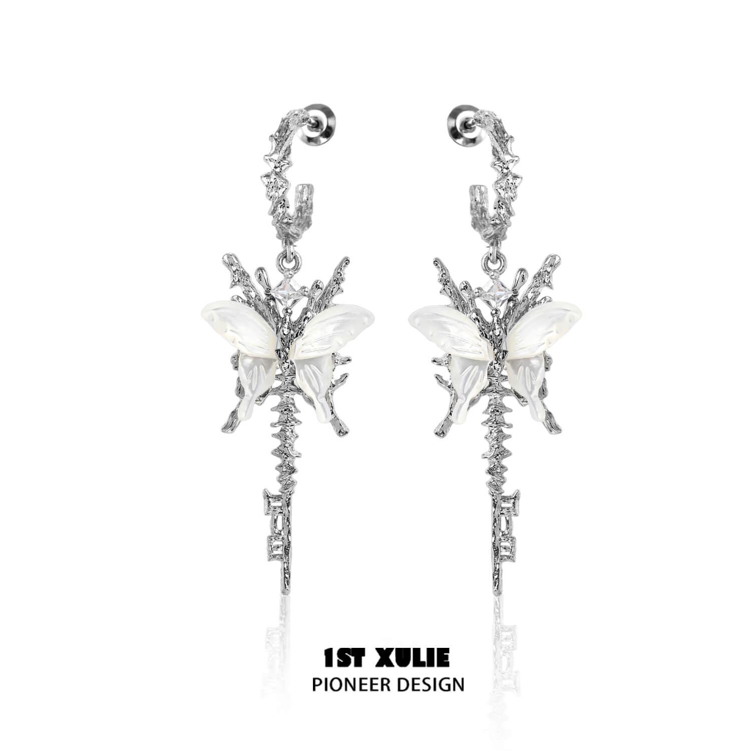 A pair of white earrings