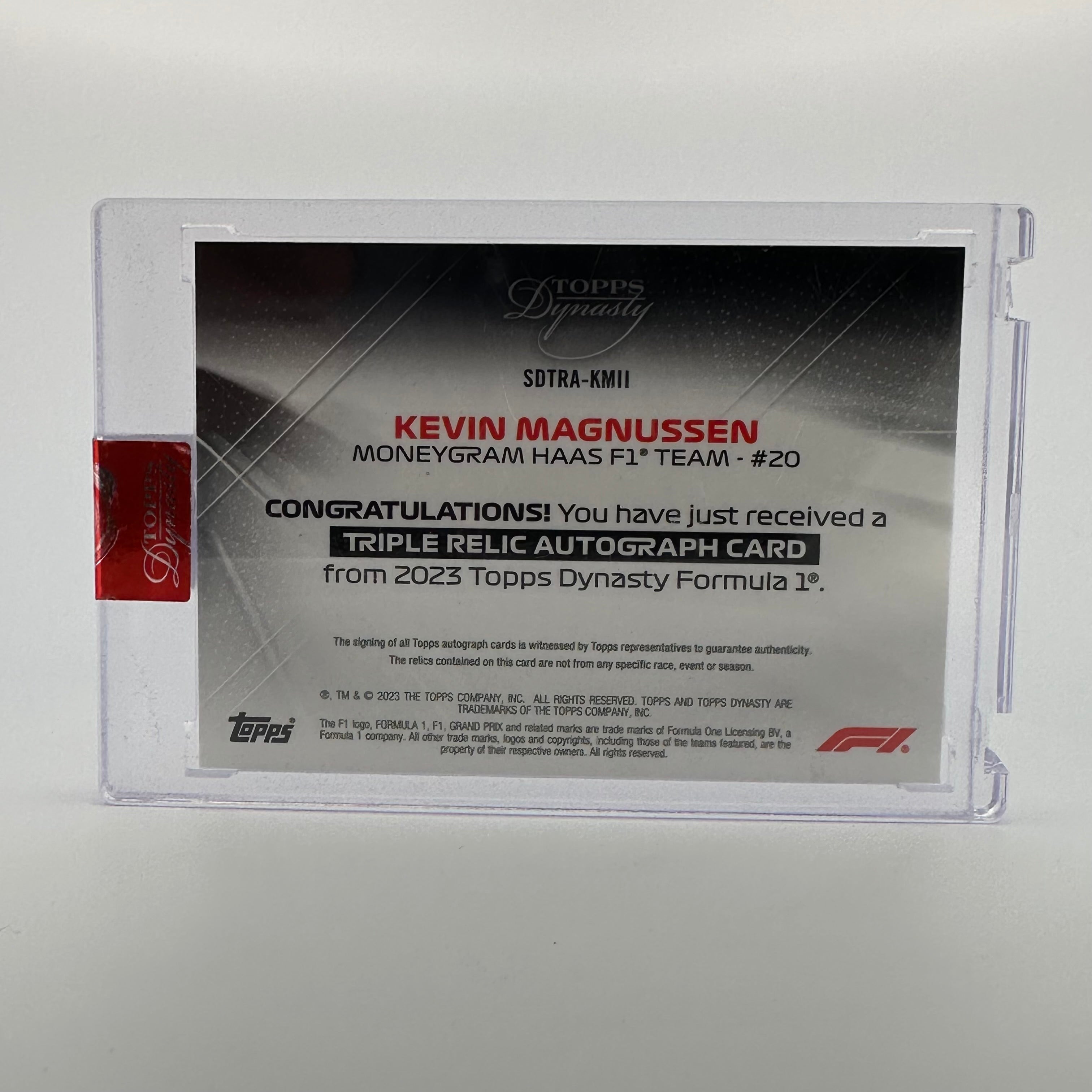 Kevin Magnussen 2023 Topps Dynasty F1 Triple Relic Autograph #SDTRA KMII - Collectible Racing Memorabilia for F1 Fans & Sports Card Collectors - Perfect for Display, Trading, and Investment