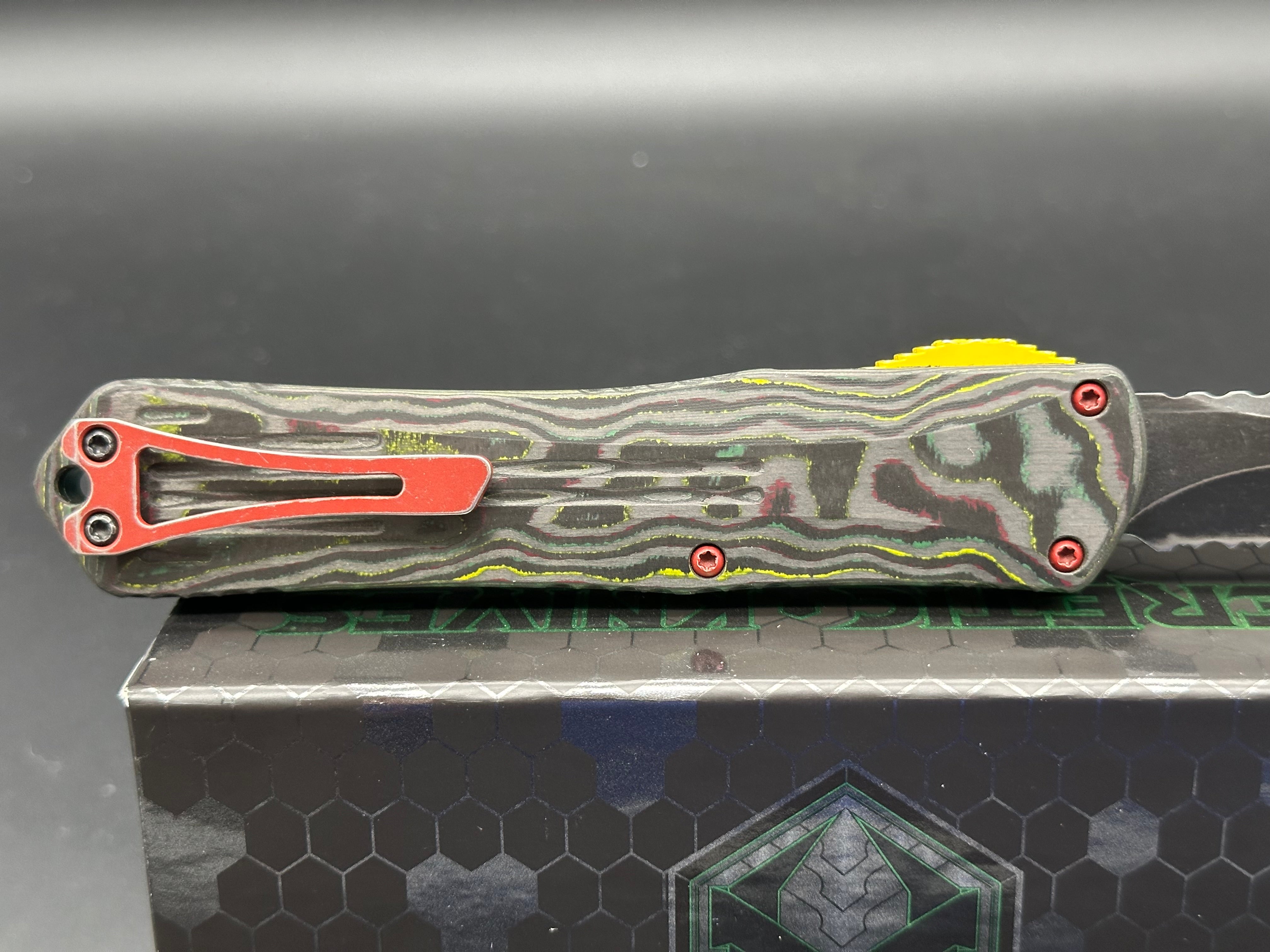 Heretic Manticore X Bounty Hunter Camo Carbon Handle OTF Knife - Black MagnaCut Serrated Tanto Blade for Tactical, Outdoor & EDC Use