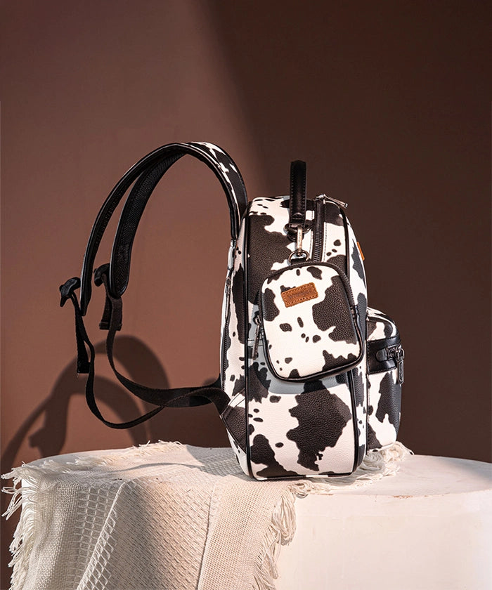Wrangler Cow Print Backpack for Women & Men - Durable Laptop Backpack with USB Charging Port - Perfect for School, College, Travel & Outdoor Adventures