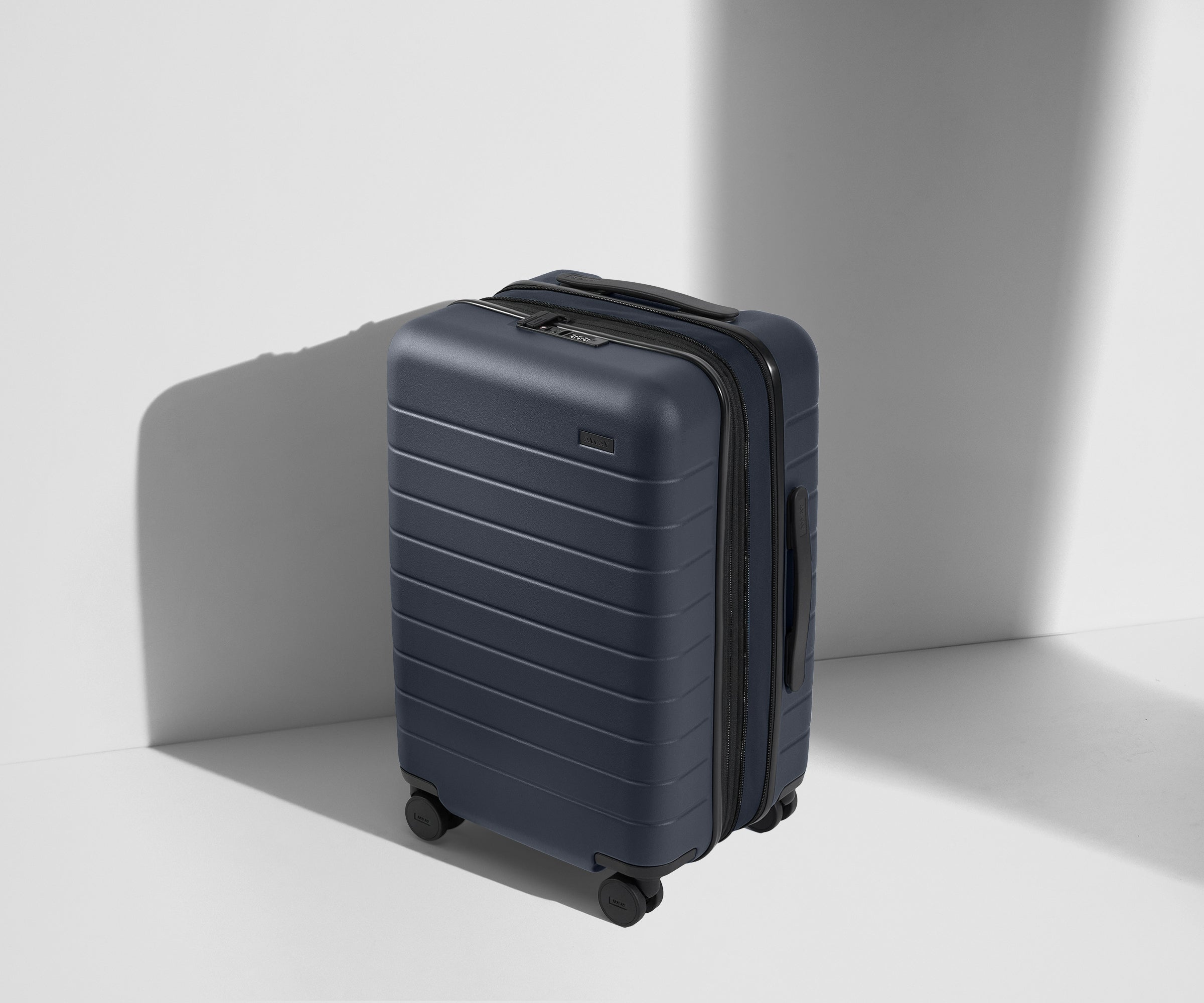 The Carry On Flex in Navy Blue - Lightweight Expandable Luggage for Travel - Perfect for Airplane, Business Trips & Weekend Getaways