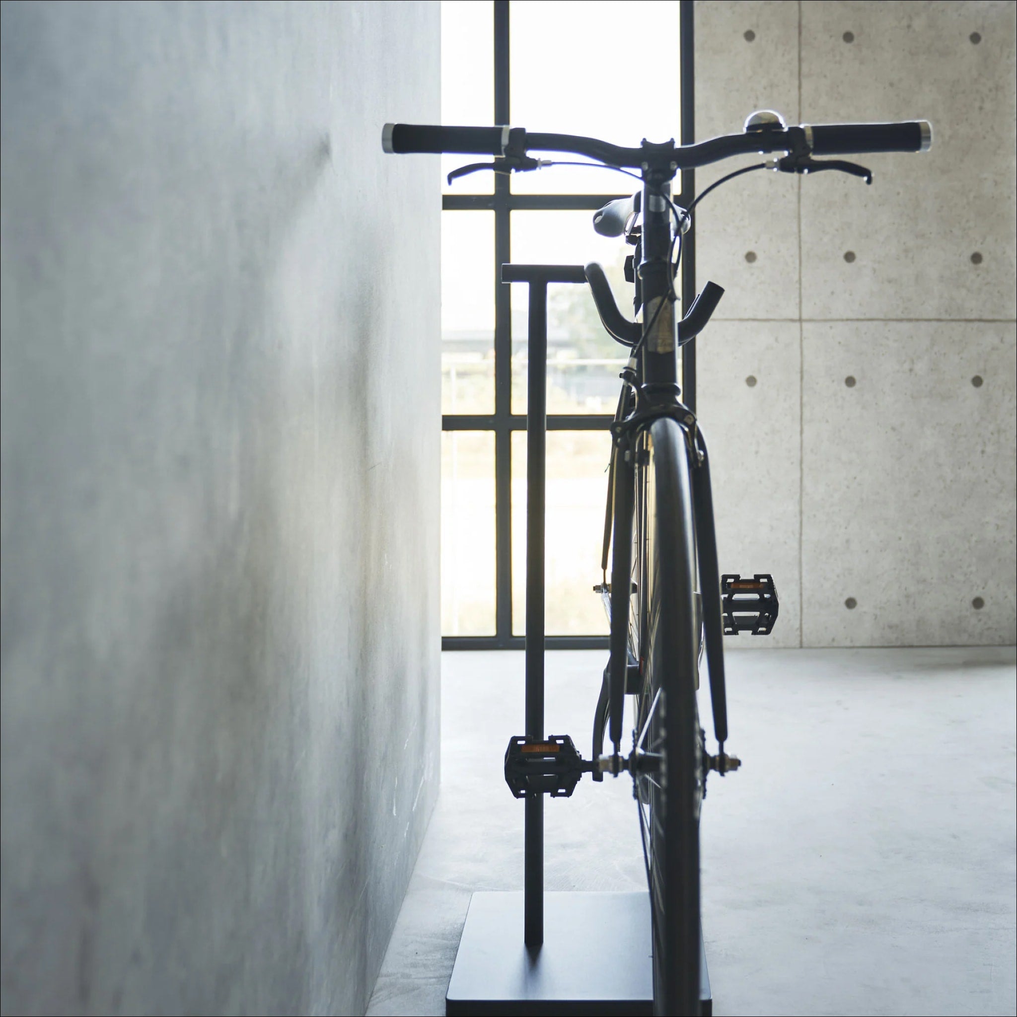 YAMAZAKI Black Tower Indoor Bike Stand - Space-Saving Bicycle Storage Rack for Home, Garage, or Apartment - Perfect for Organizing Bikes in Small Spaces