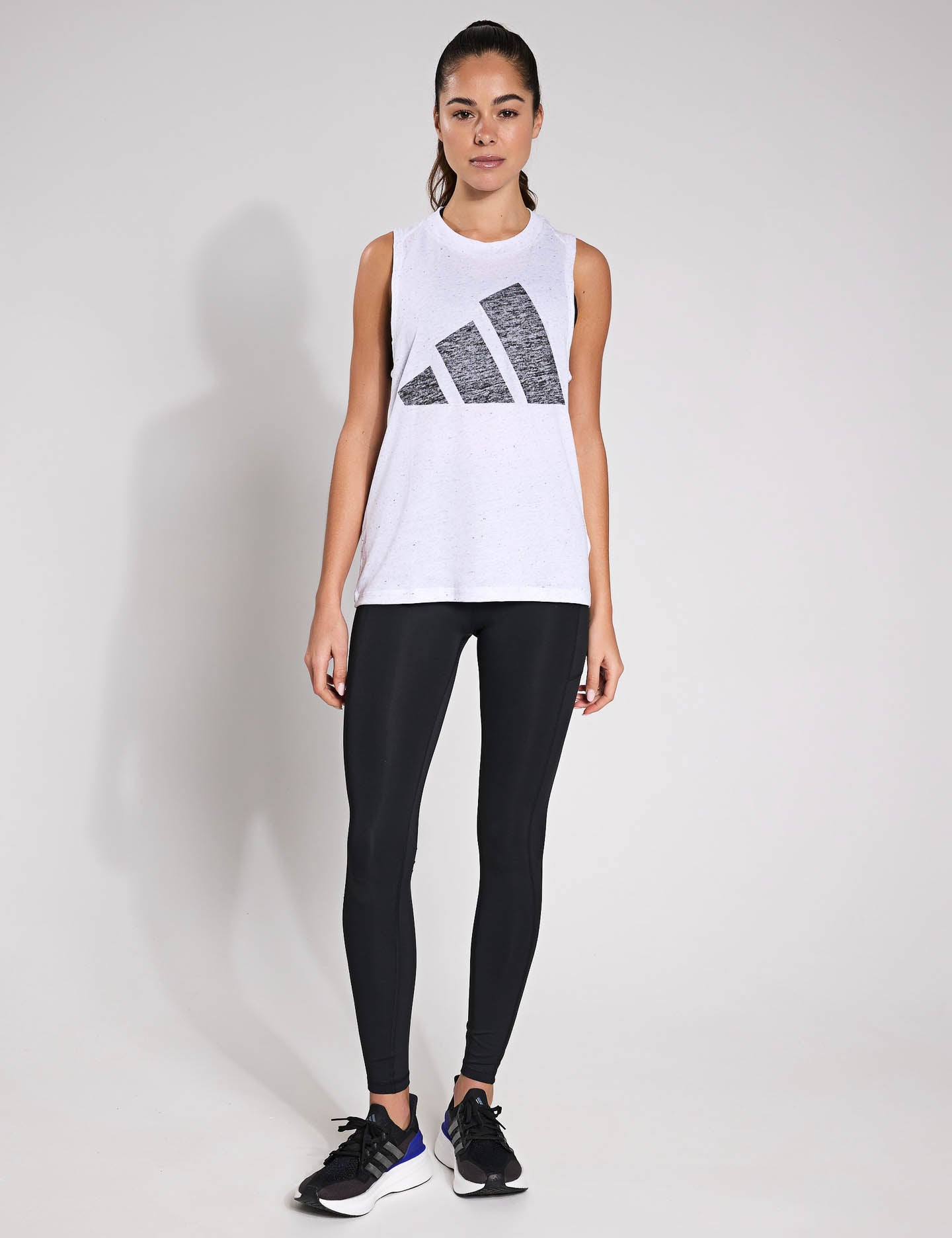 Essentials Winners Tank Top for Men & Women - Comfortable White & Black Sleeveless Shirt for Gym, Workout, and Casual Wear
