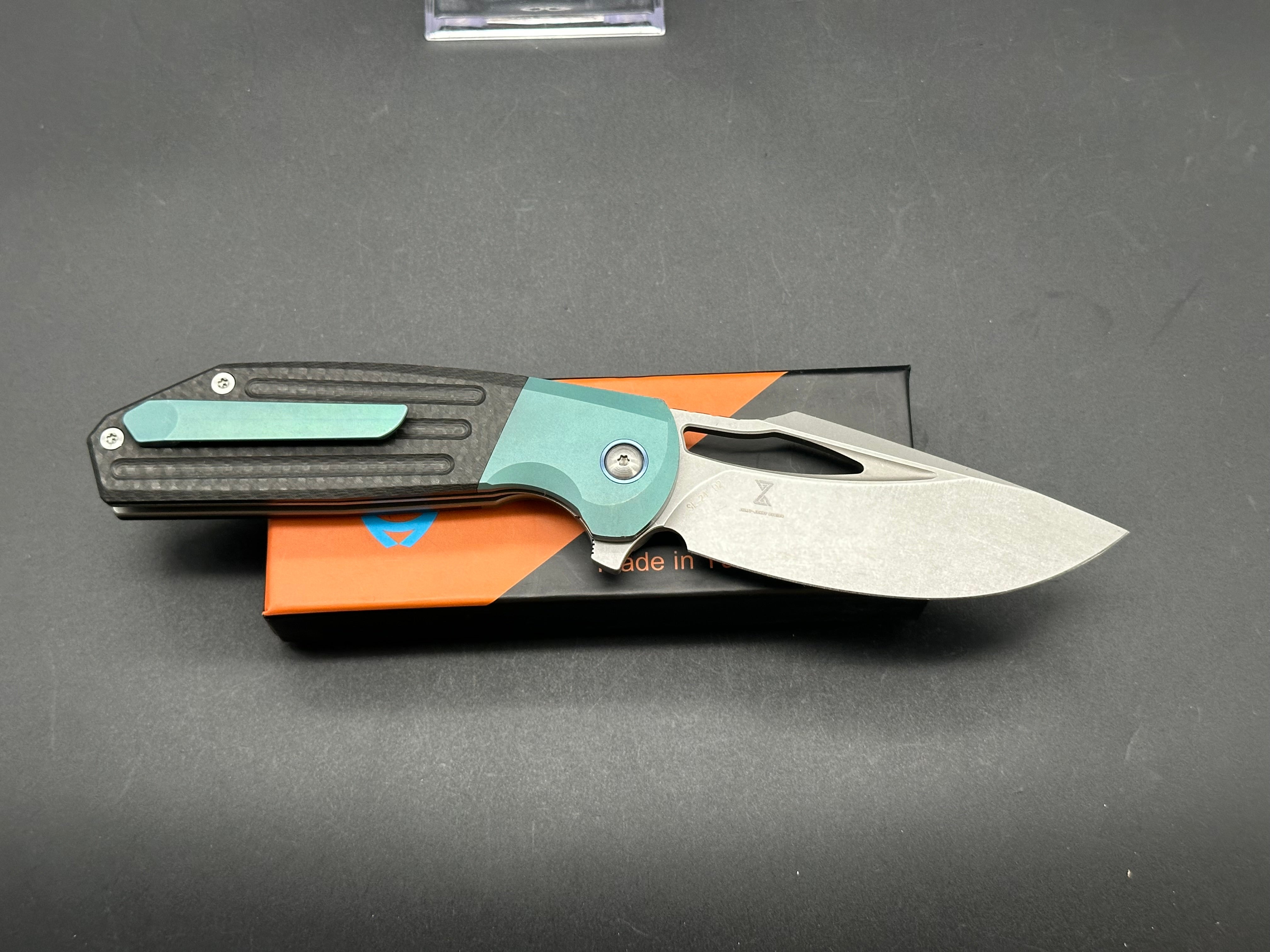 SIXLEAF SL 24 Jerry Jelly Pocket Knife - Plain Edge D2 Blade, Green Titanium Bolster & Carbon Fiber Handle - EDC, Camping, Hiking, Survival Gear