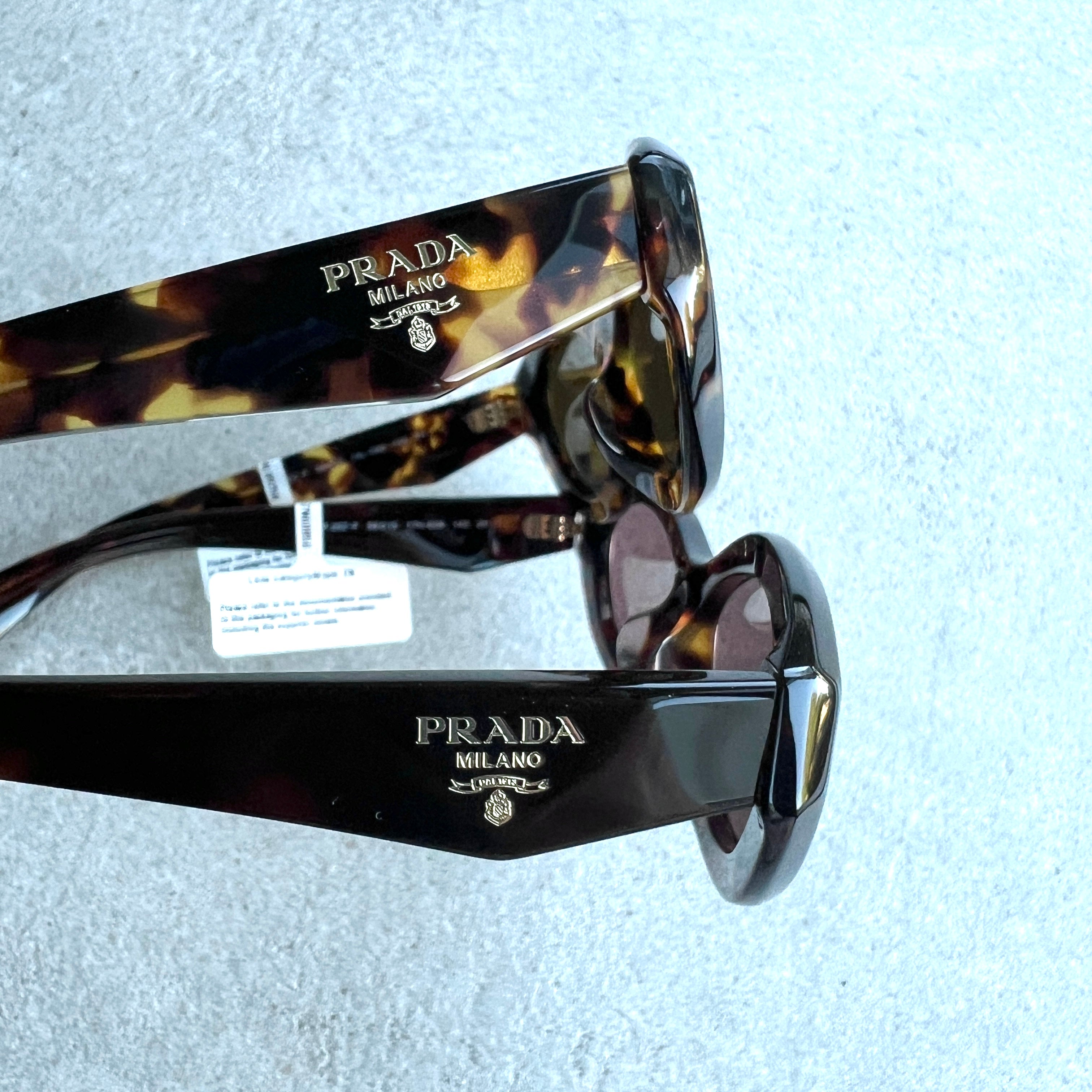 PRADA PR26ZSF Symbole Oval Sunglasses - Tortoise/Honey Frame, UV Protection, Luxury Fashion Sunglasses for Women & Men | Perfect for Beach, Driving & Outdoor Activities