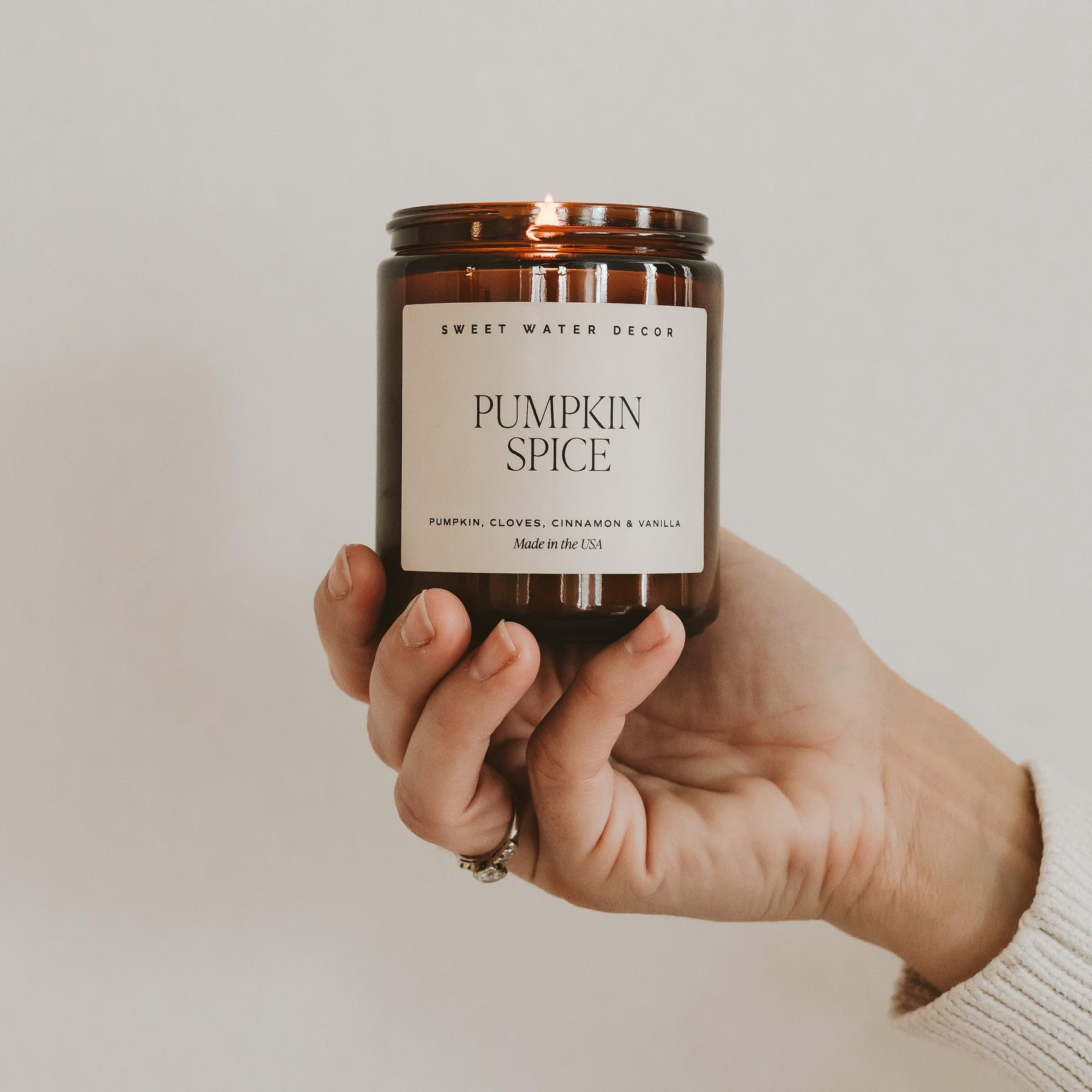 Sweet Water Decor Pumpkin Spice Scented Soy Candle - Fall Home Decor with Pumpkin, Clover, Cinnamon & Vanilla Aromas - 40 Hour Burn Time in 9Oz Amber Jar - Perfect for Cozy Autumn Evenings, Thanksgiving Decor & Holiday Gift Giving