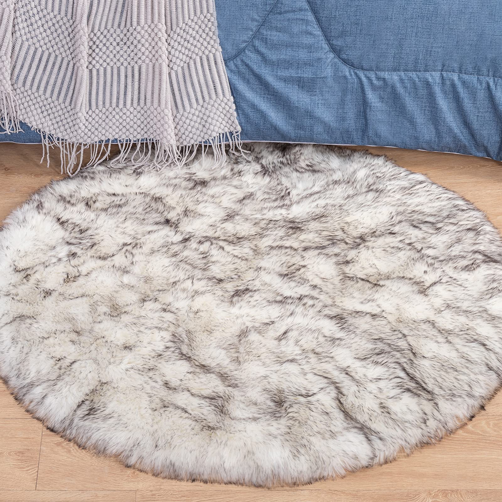 **Carvapet Faux Sheepskin Fur Round Area Rug - 5ft Fluffy Soft Floor Mat for Bedroom, Living Room, Nursery | White with Black Tips | Cozy Home Decor, Kids Play Mat, Bedside Carpet**    *(Use in living rooms for a luxurious touch, bedrooms for warmth, or nurseries as a soft play area for kids.)*