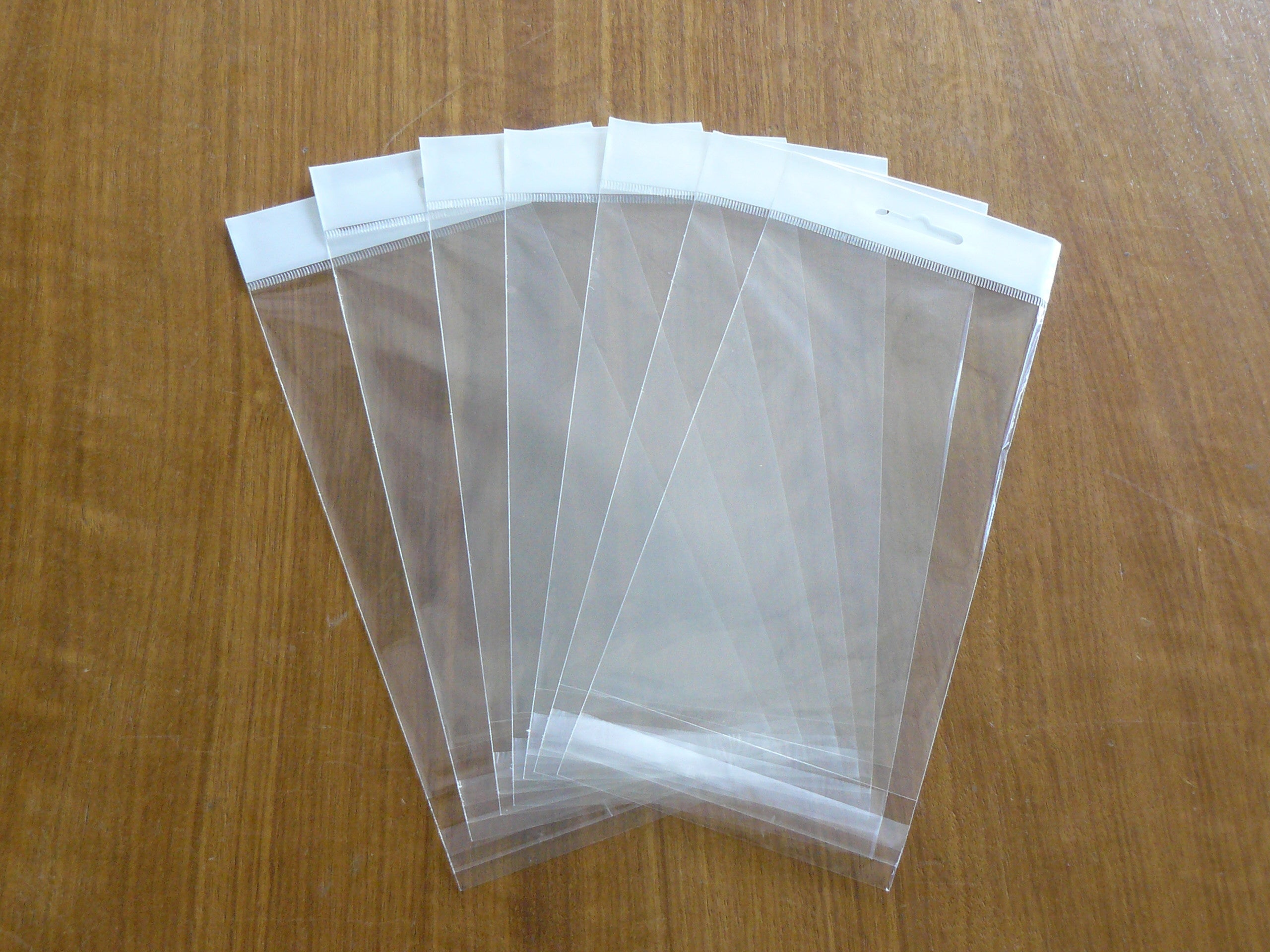 Self Adhesive Bags with Header and Butterfly Hole - Resealable Plastic Bags for Snacks, Crafts, and Office Supplies - Perfect for Food Storage, Organizing, and Gift Packaging