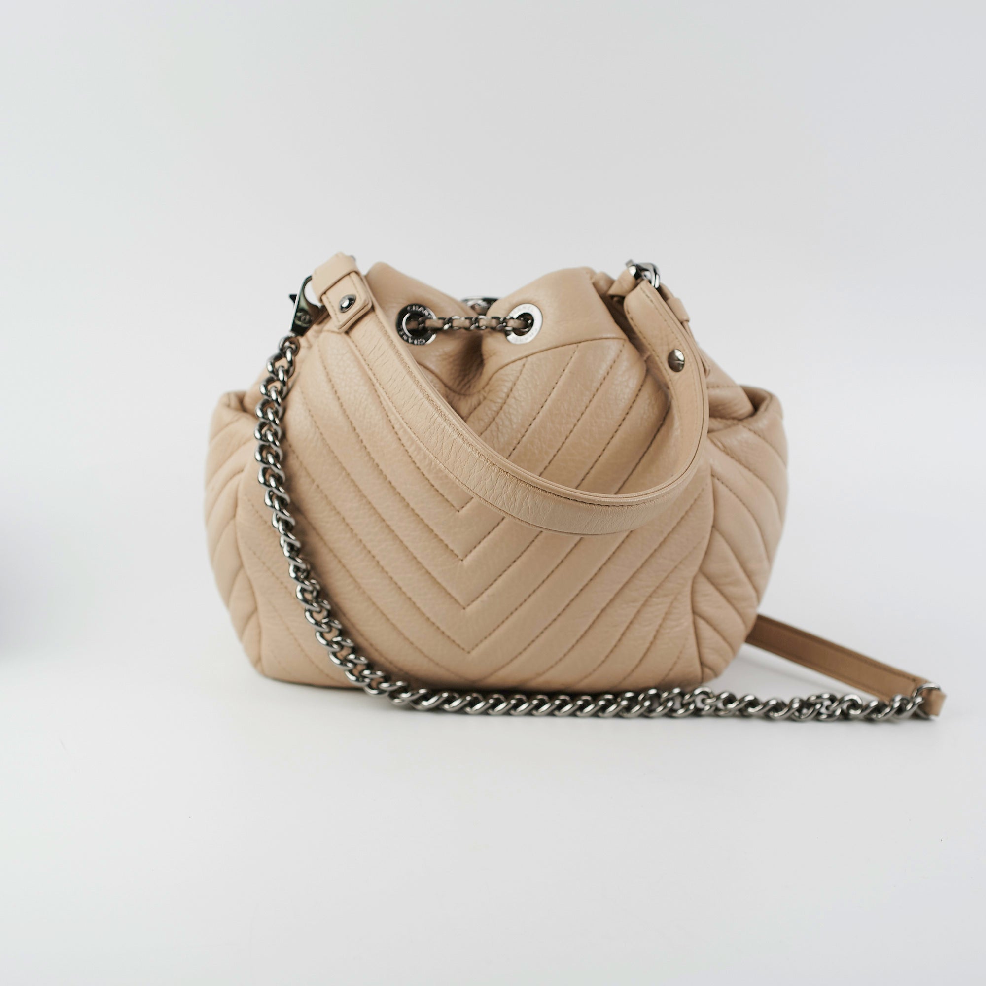 Chanel Chevron Beige Quilted Leather Bucket Bag - Luxury Designer Handbag for Women, Perfect for Everyday Use & Special Occasions